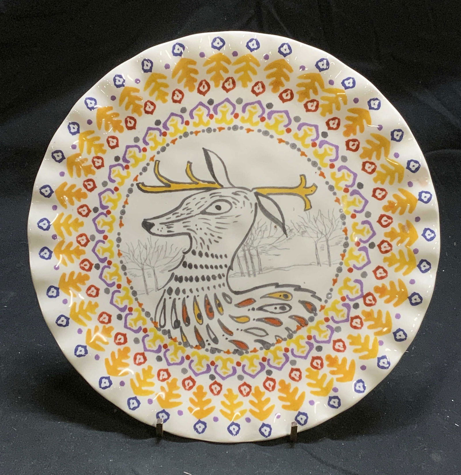 TULA EARTHENWARE Deer Plate: Tula Earthenware deer plate in hues of yellow, red, and orange. Trademarked to underside. Measures approx. 8.5 inches diameter. In good condition. Tula earthenware, Tula earthenware plate, deer plate,
