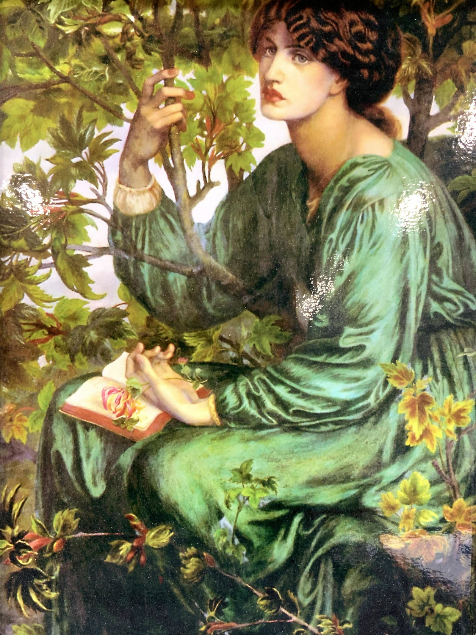 The Day Dream Litho By Rossetti: Framed litho of The Day Dream by Dante Gabriel Rossetti Subject depicts a young woman in a green dress sitting in forest with a book in her lap and eyes looking off. Framed in black wooden frame, appr