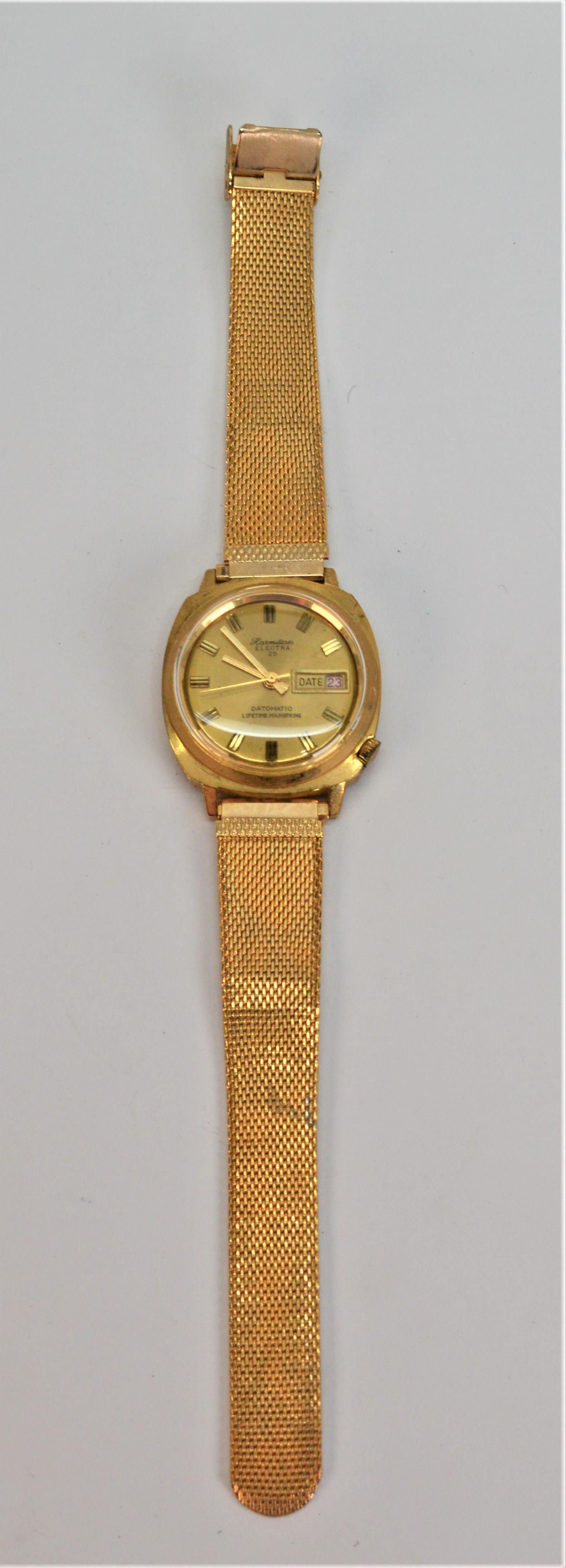 Mens Vintage Hamilton Style Watch: Hamilton Electrica 25 Style. Face appears to read Harmilton or Hormilton. Has a second hand and date display. 36MM cage. 4.5MM gold tone mesh bracelet. Needs battery. As is. -NB