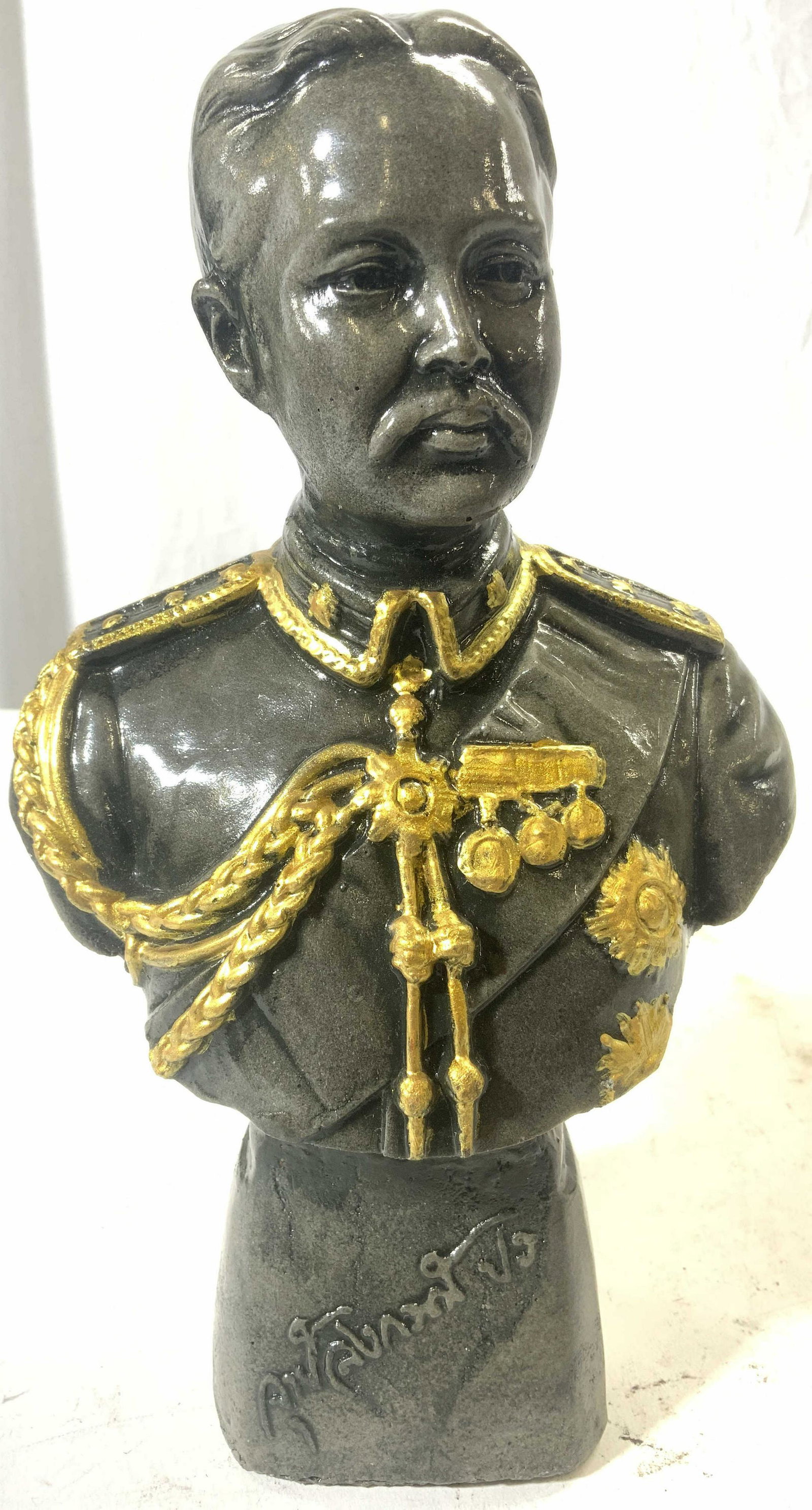 Signed Repro Bust Of General: Piece is signed illegibly. Bust depicts general in uniform. Piece is made from a resinous composite material. Bust measures approx 10 inches tall 6 inches wide 4 inches deep. Bust, bust sculpture, gen