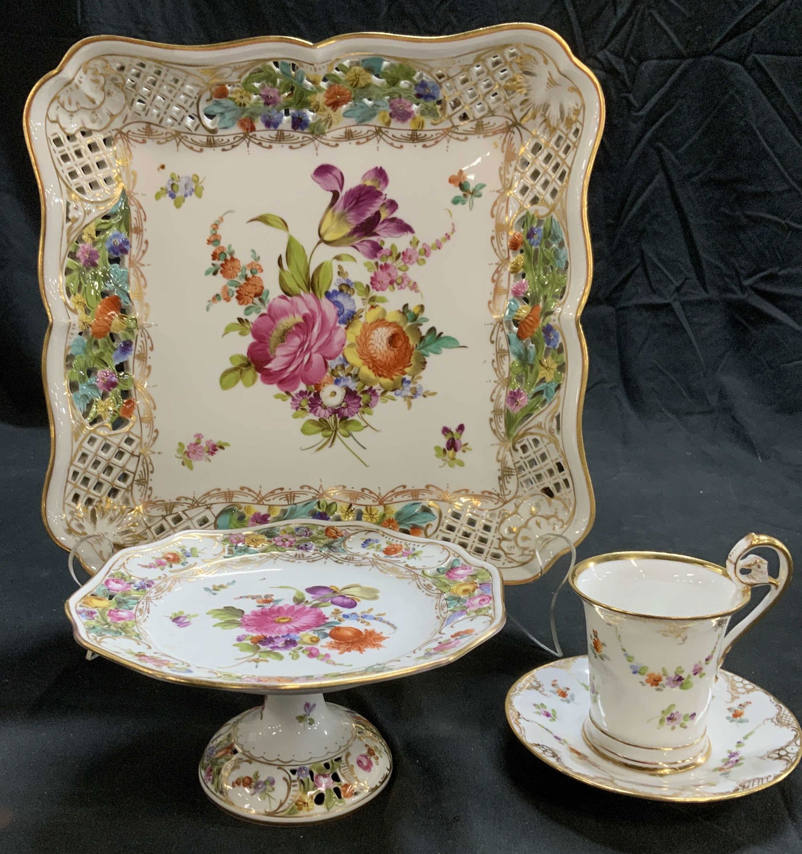 DRESDEN Table Porcelainware , Lot 4 Germany: White Porcelain with hand painted flowers in brilliant colors of fuchsia, orange , purple, and accents with 24 K gilt all Hallmarked Dresden. Pierced porcelain gallery plate, perfect as a centerpiece.