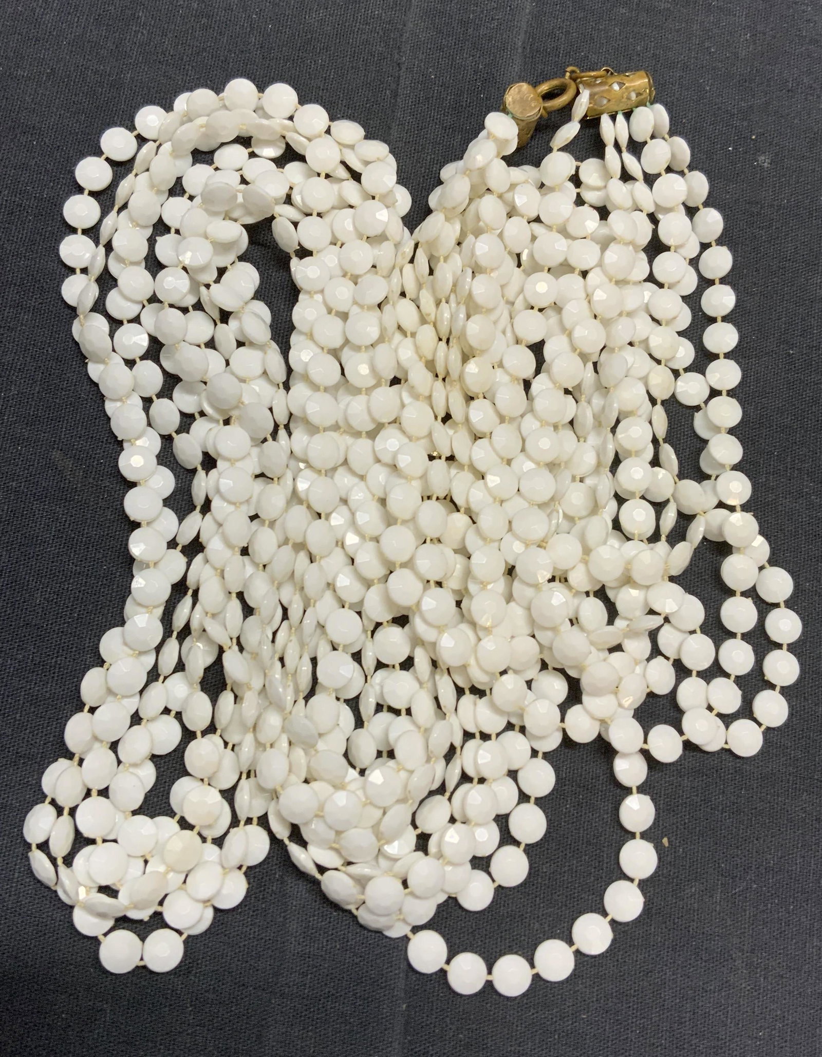 Multi Chain Faceted White Beaded Necklace: Multi chain necklace with white faceted beads. Measures approx. 50 inches long. In good condition. Estate jewelry, costume jewelry, cocktail jewelry, fashion jewelry, accessories, fashion accessories,