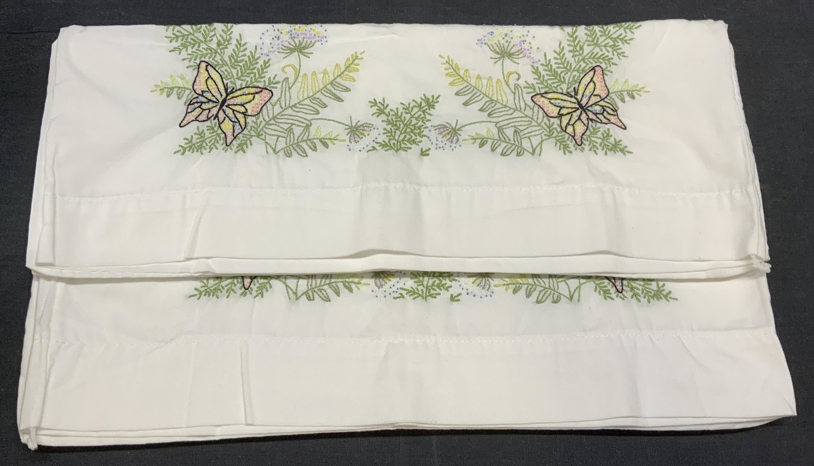 Pair THOMASTON Butterfly Embroidered Pillowcases: Pair of THOMASTON white butterfly embroidered pillowcases. Polyester and cotton blend. Lin good condition. Measure approx. 18.5 x 29.5 inches each. THOMASTON, THOMASTON pillowcase, white pillowcase, b