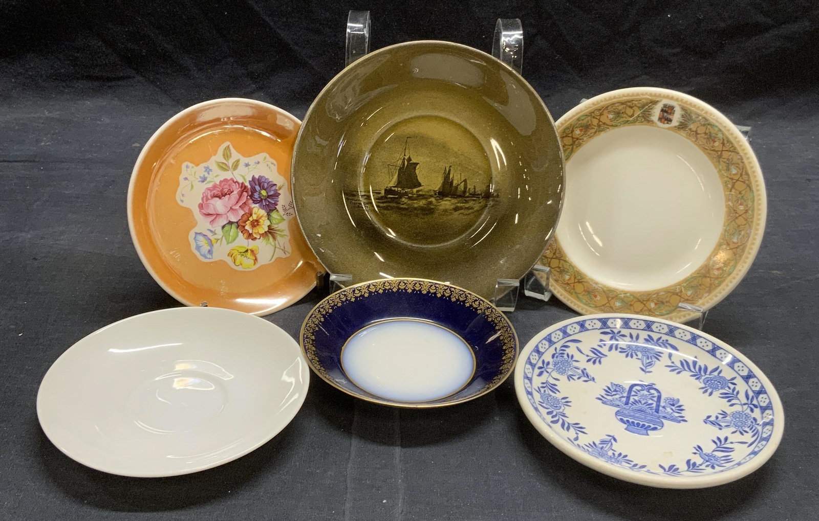 Lot 6 Porcelain & China Plates & Saucers: 1 solid white porcelain saucer, approx. 4.75 inches diameter. 1 Jackson China Cocks Hotel & Restaurant Supply Co saucer with blue floral motif, approx. 4 7/8 inches diameter. 1 Lamberton Scammell porc