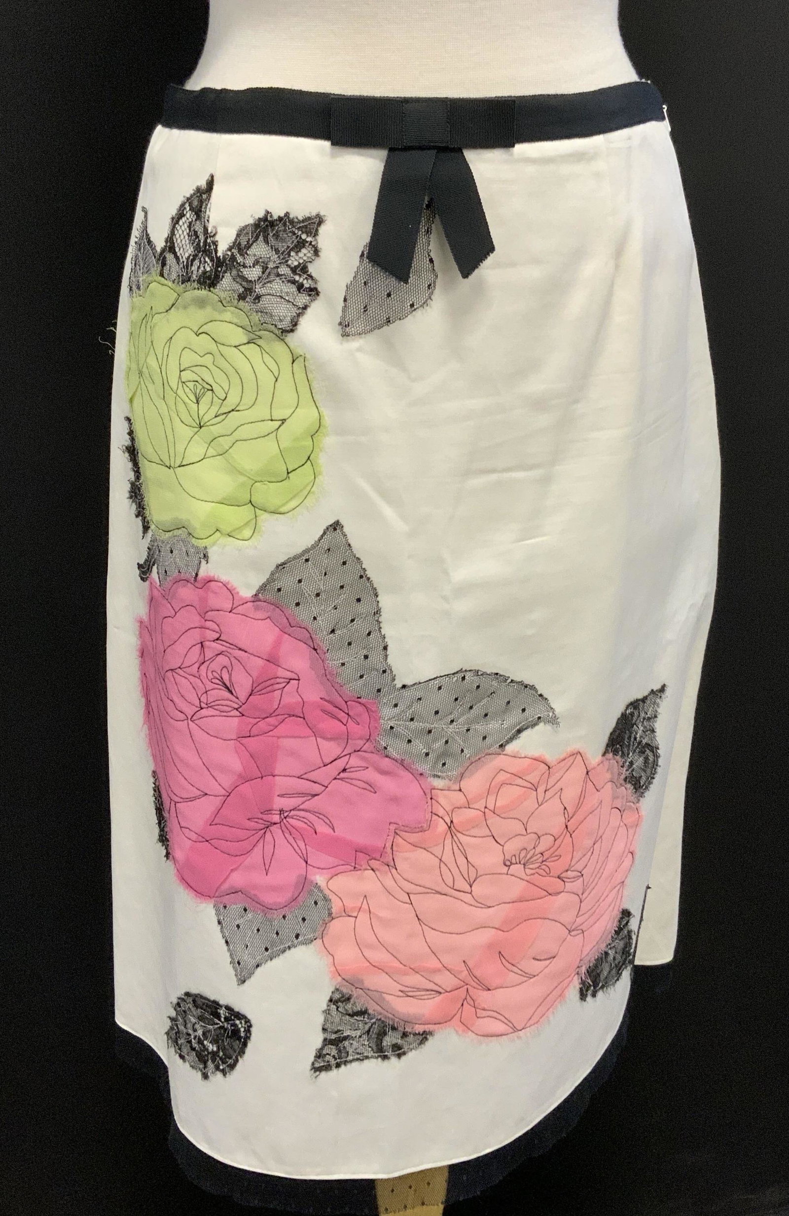 JON White Satin Floral Applique Skirt: Jon white satin midi skirt with floral Applique detail in hues of pink and green. Size 8. Cotton blend. Gently worn. Jon, Jon skirt, ladies designer skirt, ladies designer fashion, ladies satin skirt,