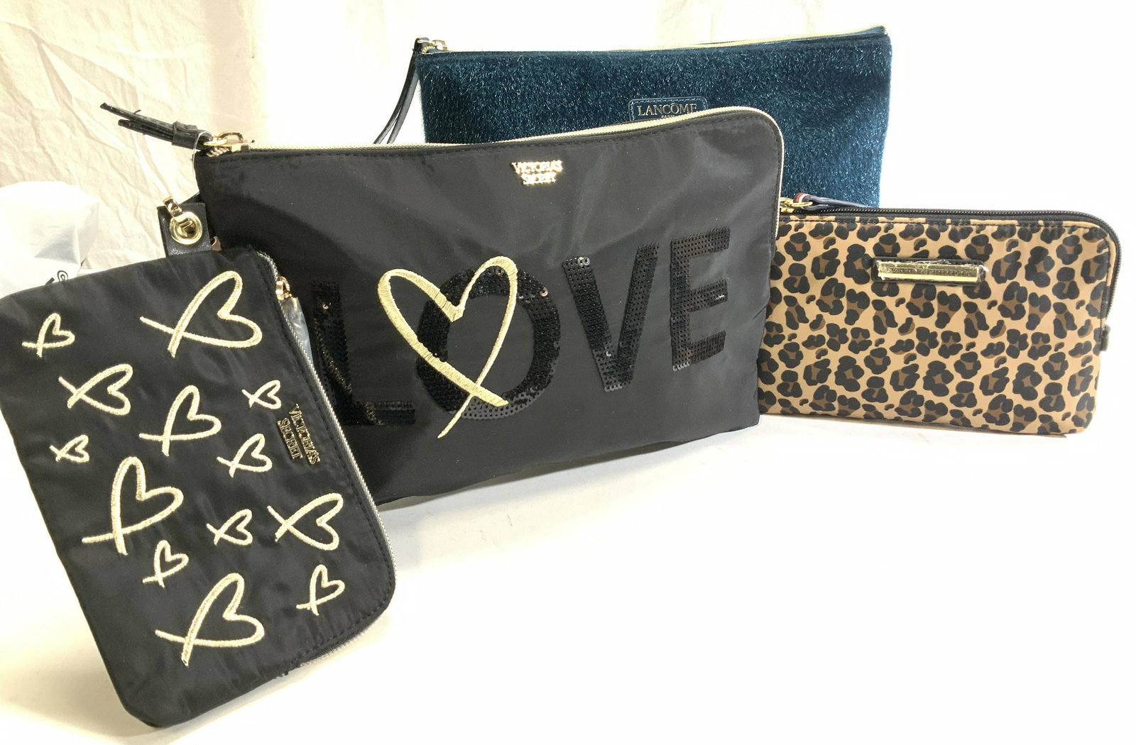 Lot 4 Victorias Secret, Lancôme Bags NWT: Pair black Victorias Secret Cosmetic bag/ Toiletry bag/ wristlet, purse evening bag. Larger bag has word LOVE spelled with black sequins , 11 x 7.5 in. Smaller has gold embroidered heart design, 6.5 x
