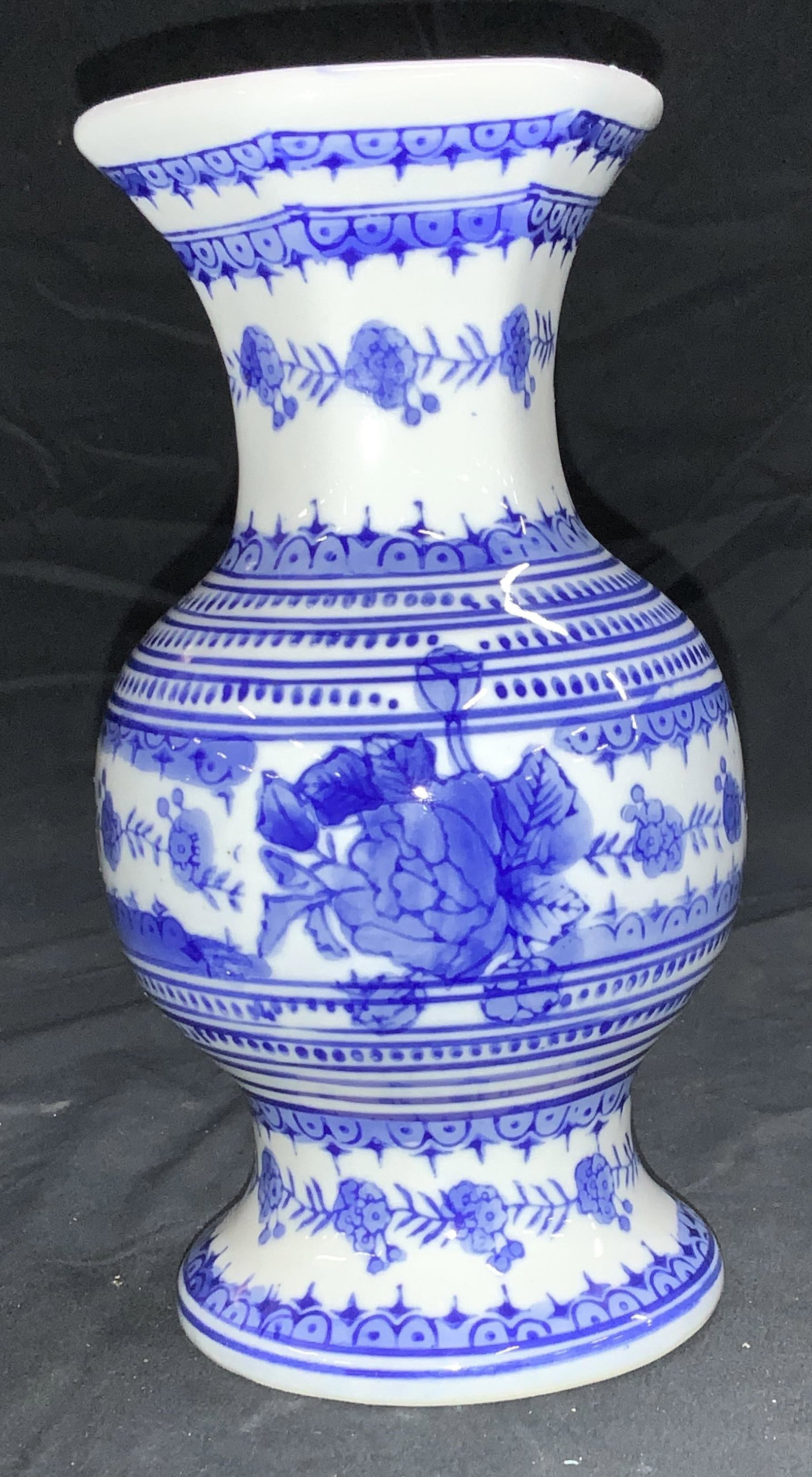 Silvestri Blue & White Porcelain Vase: Porcelain flower vase with faceted sided neck, decorated florals. Signed on underside- handcrafted for Silvestri. Measures 8 x 5 in. vessel, home decor, home accessories, collectible blue and white po