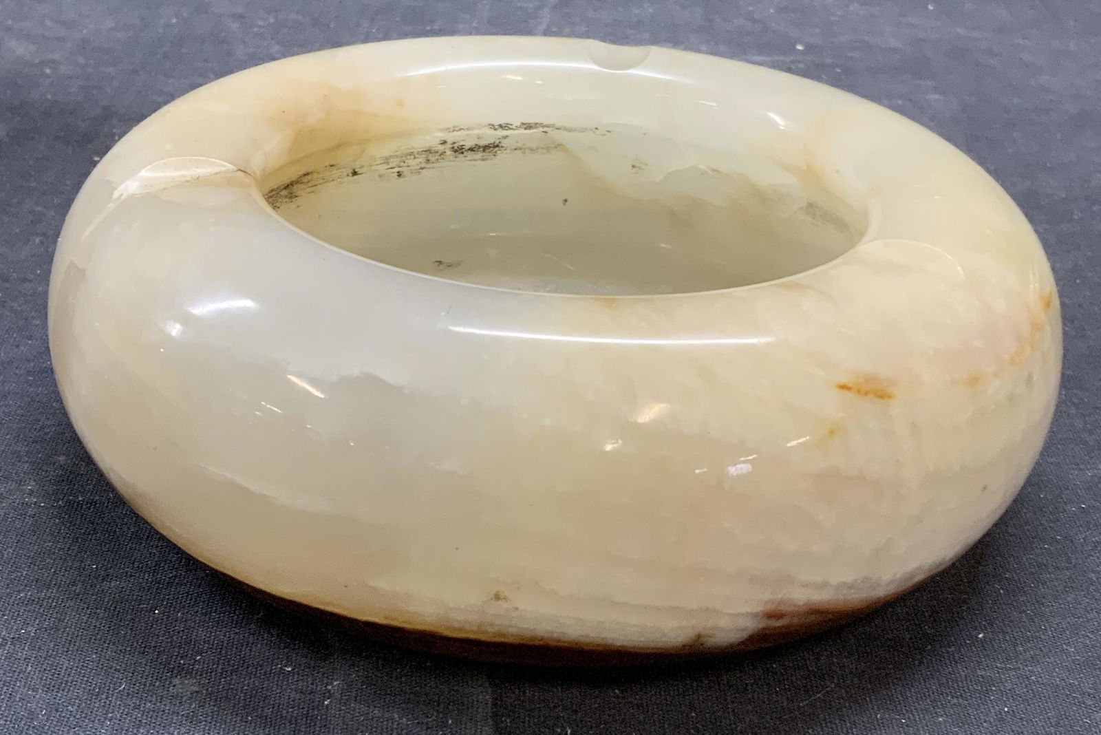 Vintage Natural Stone Ashtray: Vintage natural stone ashtray. Crack to side observed. Measures approx. 6 inches diameter and 2 inches tall. Piece has weight. Ashtray, stone ashtray, natural stone ashtray, vintage ashtray, tab,ple d