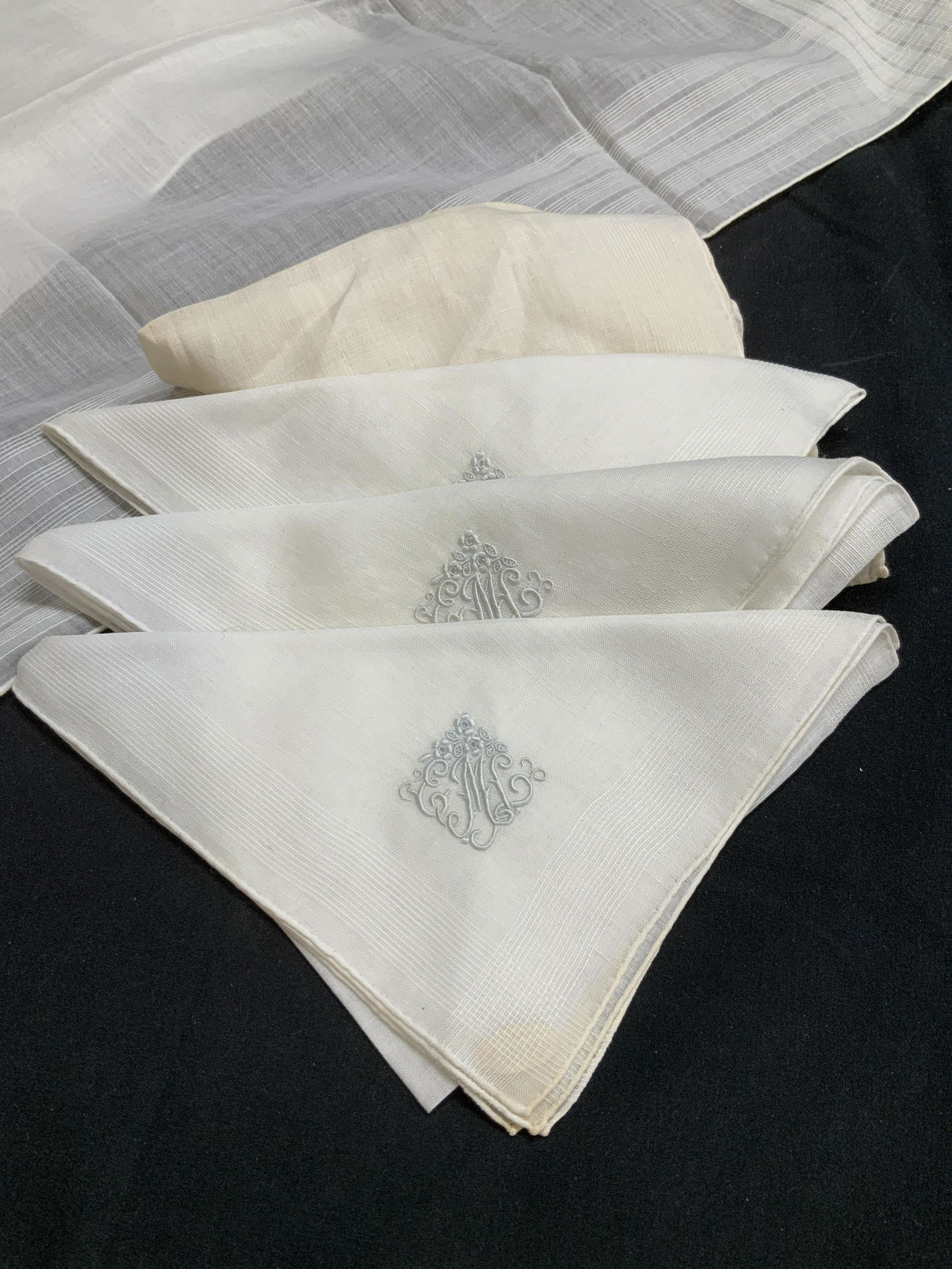 Set 6 Vintage White Linen Hankies: Linen or cotton hankies, white, some need bleaching.. 4 monogrammed with letter M. ( all monogrammed) Larger handkerchief measures 17.5 x 17.5 in. Smaller measures 12 x 12 in. Linen jacket pocket hank