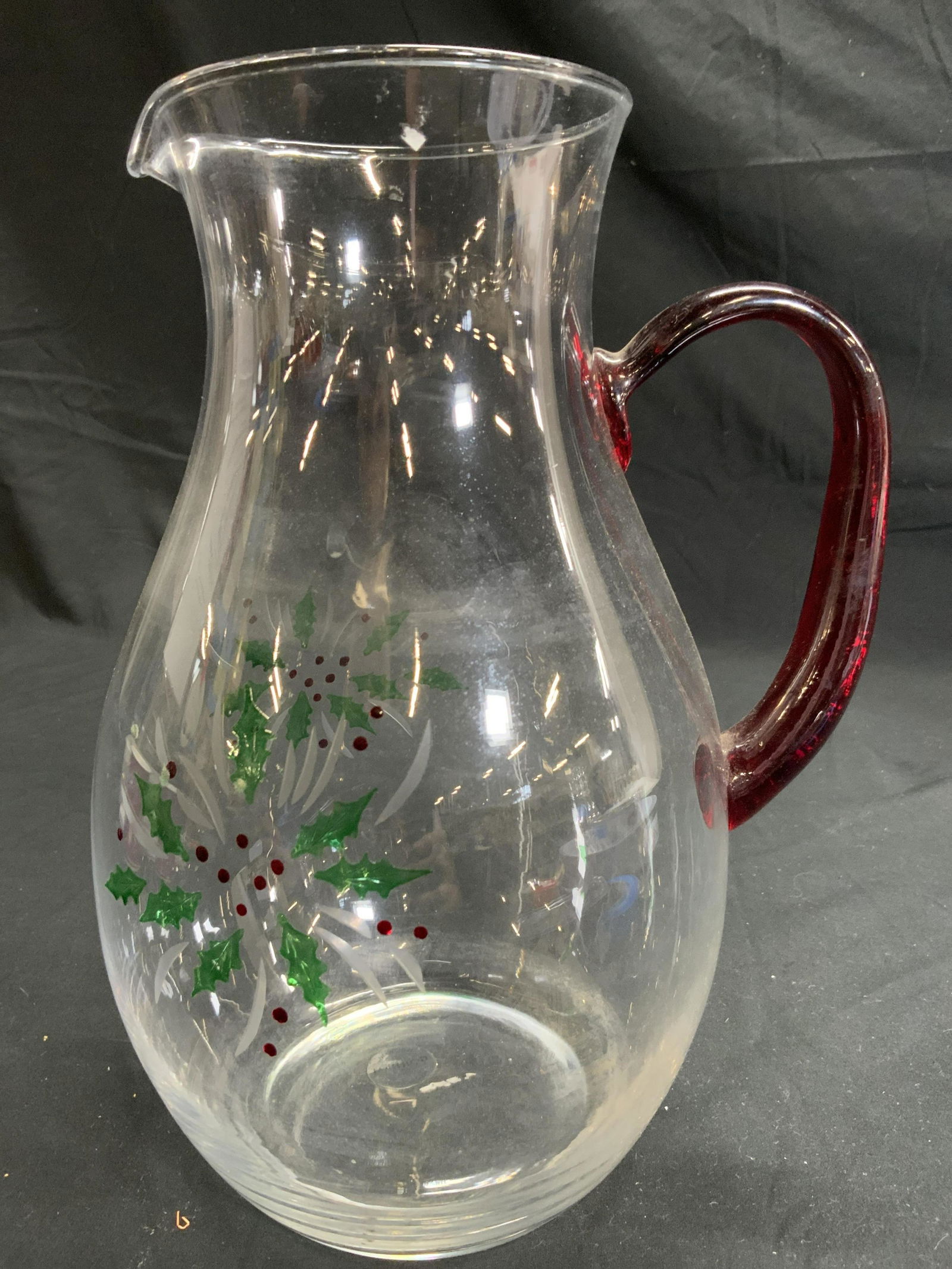 GORHAM Art Glass Holiday Pitcher Vessel: Underside has tag which reads GORHAM. Piece is glass with red hand crafted handle, & mistletoe detail. Pitcher measures approx 10.5 inches tall 6 inches wide 8 inches deep. Pitcher, glass pitcher, Art