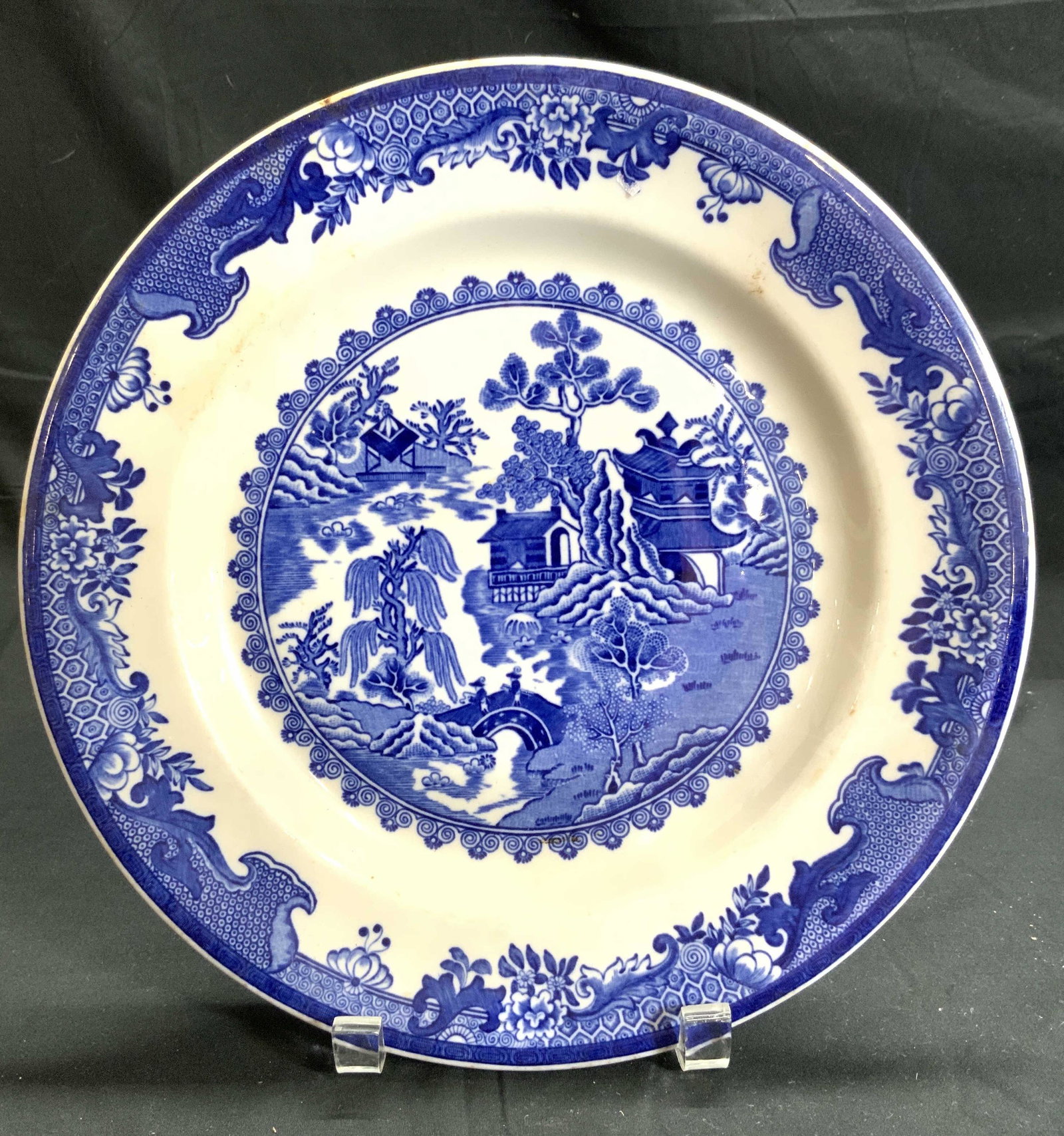 IDEAL LUNCH PLATE Vintage Porcelain Plate USA: Underside is marked IDEAL LUNCH PLATE MADE IN USA. Piece is white with blue willow pattern, blue toned floral, leaf, geometric detail & depiction of village. Plate measures approx 11.25 inches wide. P