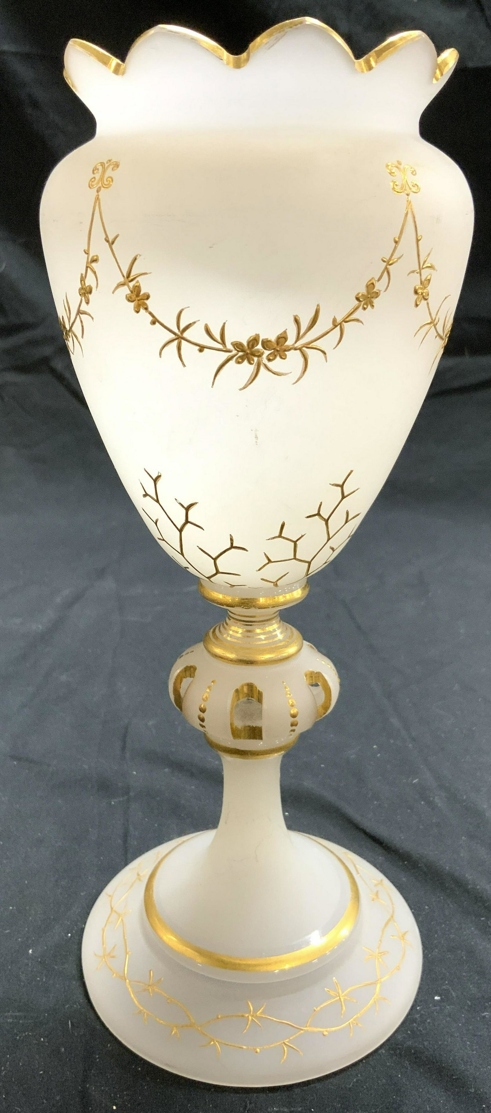 Victorian Frosted Glass Goblet Vessel W Gilt: Goblet is glass. Piece has frosted exterior in addition to gold gilt floral, vine and leaf detail. Rim has rounded teeth. Piece measures approx 10 inches tall 4 inches wide. Goblet, glass goblet, art 
