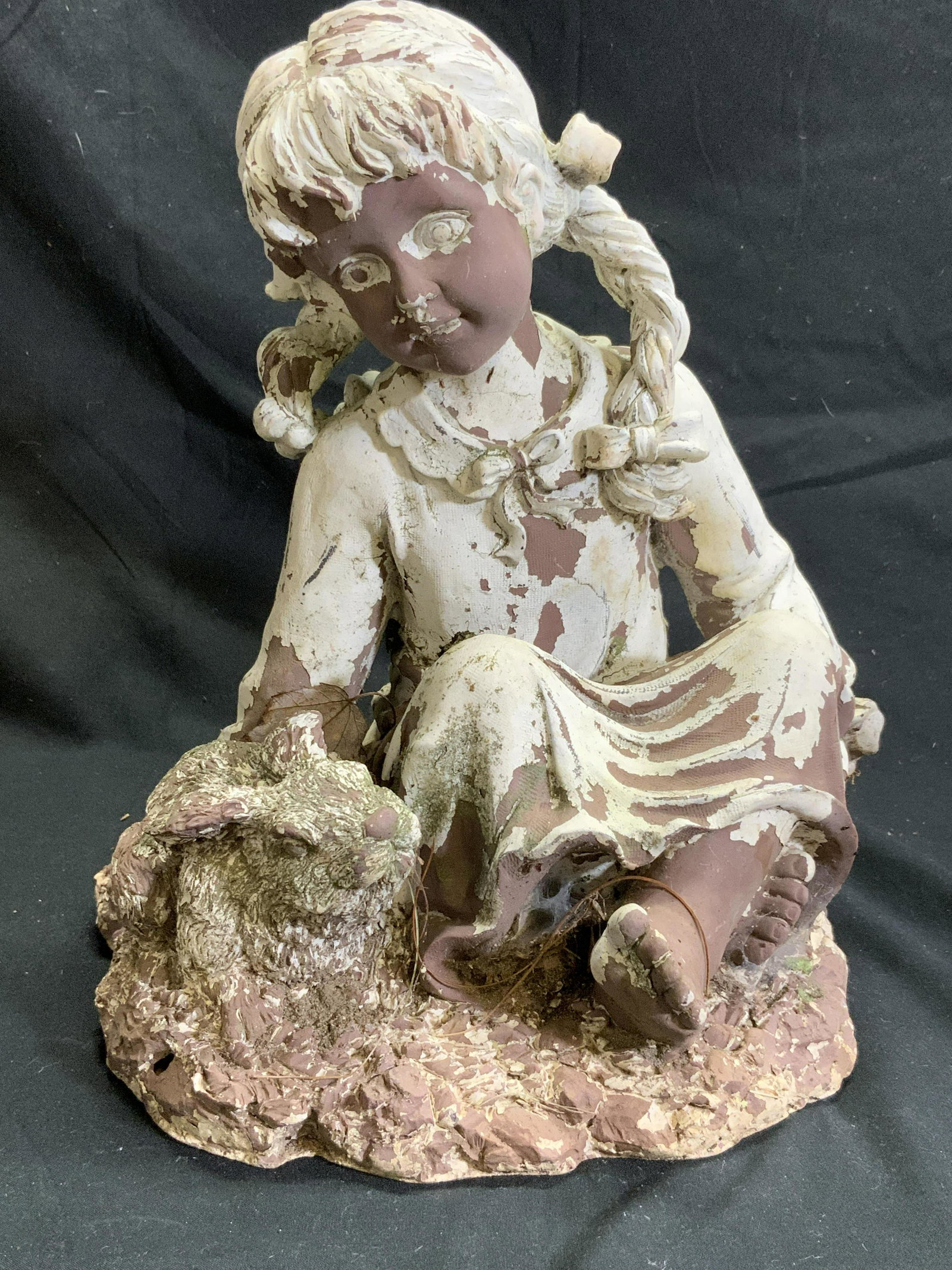 Vntg Outdoor Wooden Seated Girl Garden Statuary: Garden statuary is wooden. Piece is vintage possibly antique. Depicts a seated female figure with rabbit. Piece is possibly hand crafted. Measures approx 10 inches tall 8.5 inches wide 7.5 inches deep