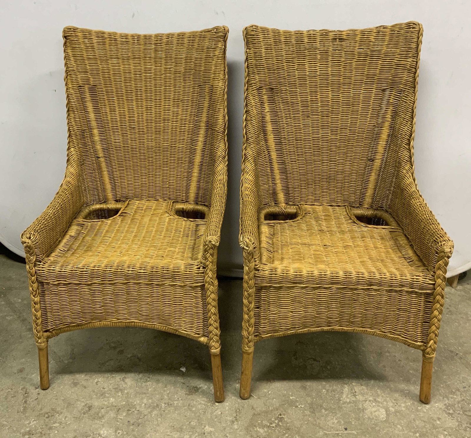 Pair Vintage Tan Rattan Outdoor Chairs: Pair of vintage tan rattan woven outdoor dining chairs. Surface wear to both pieces consistent with exposure. Measures approx. 21 x 22.5 x 40.5 inches. Vintage furniture, outdoor furniture, outdoor di