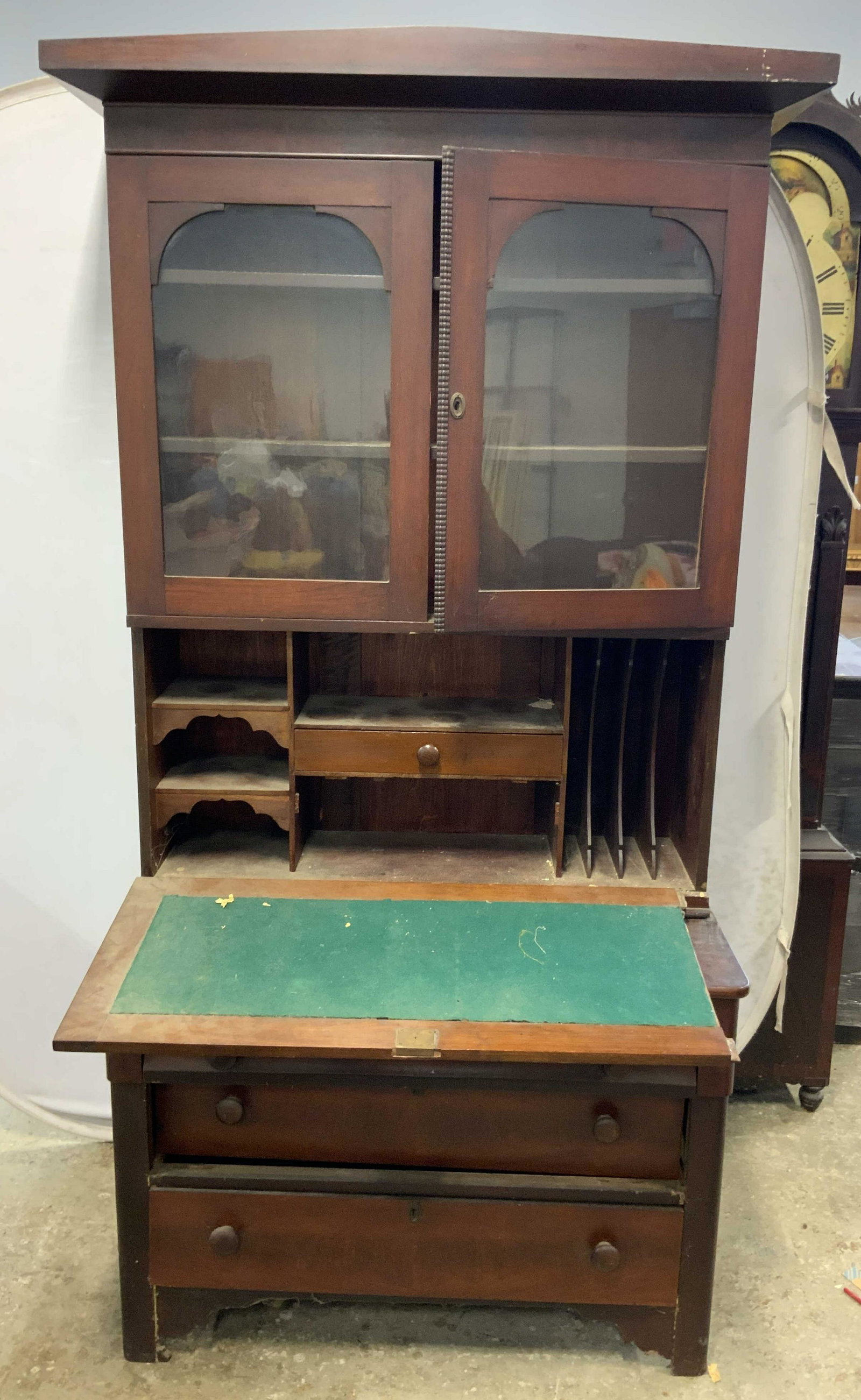 Vintage Wooden Secretary W Writers Desk: Secretary is vintage possibly antique. Piece is brown toned and wooden. Secretary has flip open writers desk area, windowed display cabinet to upper half, 3 drawers to lower half with knob style drawe