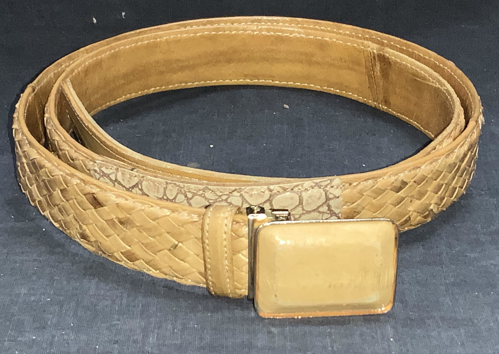 Eel Skin Leather Lattice Pattern Belt, Korea: Tan leather, braided in lattice pattern, labeled Genuine Eel Skin , Made in Korea, . Some wear to leather on buckle. 47 in total length, prong lengths 43 - 39.5 in. Width 1 in. Belt, Eel Skin Leather 