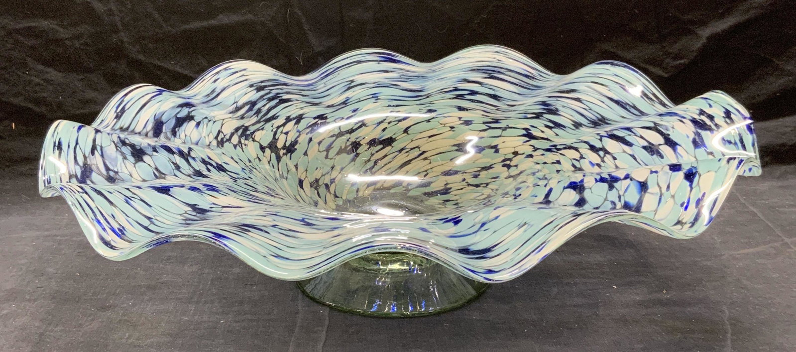 Hand Blown Art Glass Centerpiece Bowl Mexico: Hand blown blue swirl Art glass centerpiece bowl with handkerchief rim. Marked Made in Mexico to underside. In good condition. Measures approx. 19.5 inches diameter and 5 inches tall. Art glass, art g