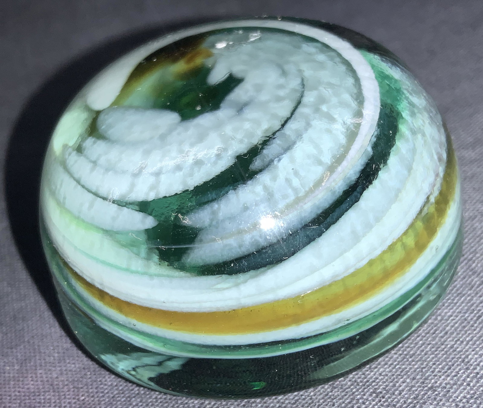 Hand Blown Teal Spiral Art Glass Paperweight: Hand blown art glass paperweight, Teal in tone with spirals of white and yellow. Approximately 1.75 Inch tall and 2 inch diameter. Art glass paperweight, paperweight, office decor home decor, tabletop