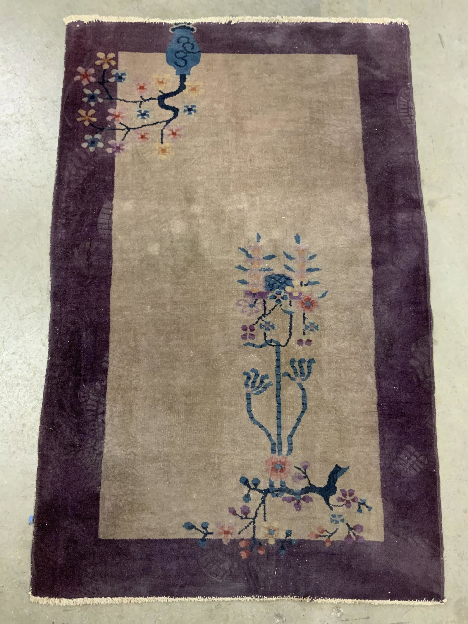 Vintage Handmade Chinese Art Deco Wool Rug: Rug is handmade and wool. Piece has intricate multi toned floral, vine and leaf in vase detail. Rug is vintage possibly antique. Measures approx 59 inches long 37 inches wide. Rug, carpet, vintage rug