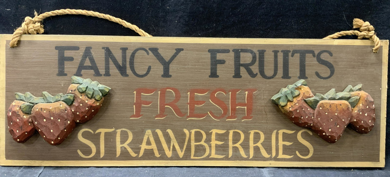 Hand Carved & Painted Wooden Strawberry Sign: Hand carved and hand painted wooden sign reading, Fancy Fruits Fresh Strawberries. With 3D carved wooden straw berries affixed to corners of sign. attached to rope for hanging. Approximately 8 x 24 in