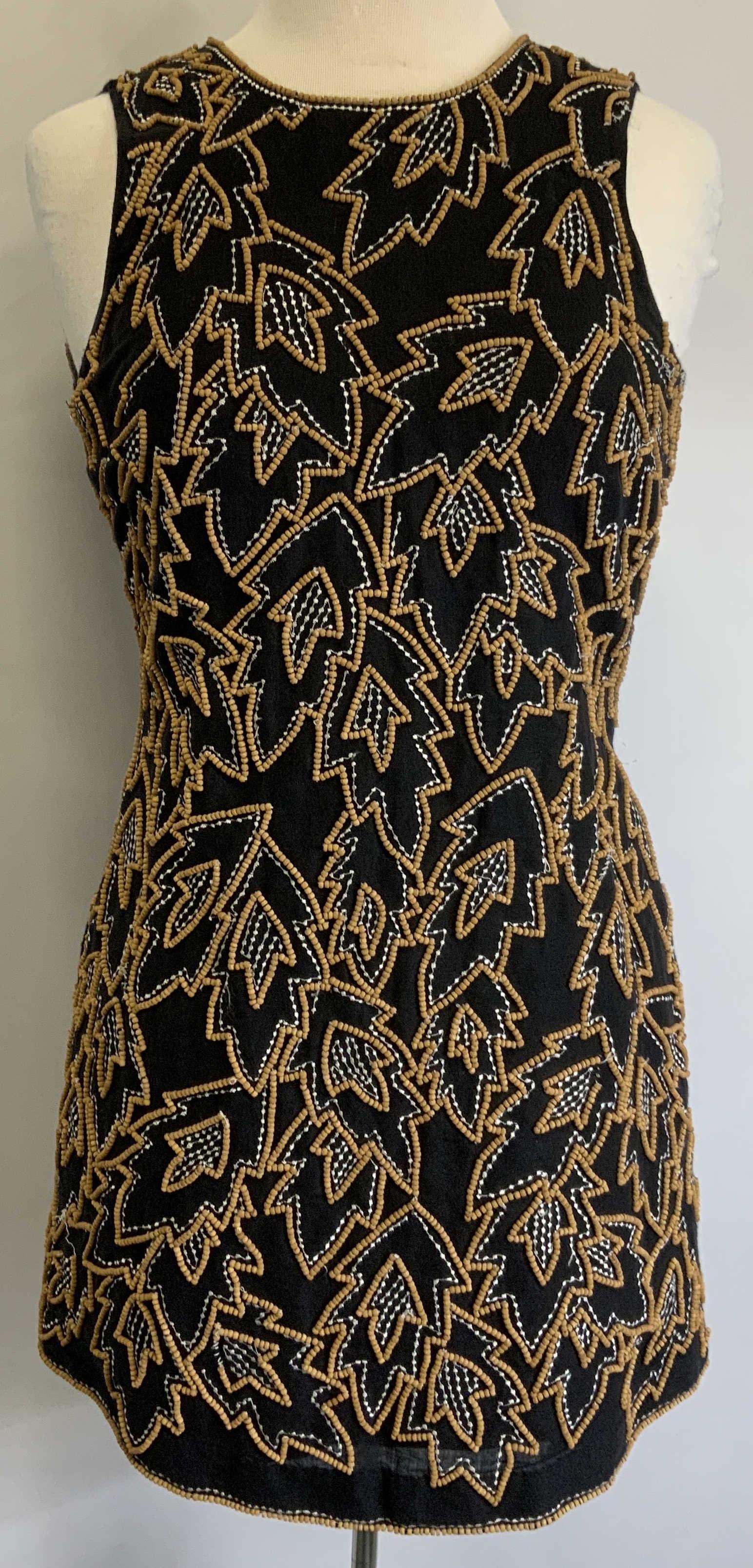 FRENCH CONNECTION Black Beaded Botanical Dress: French Connection black sleeveless dress with white embroidery and brown beaded botanical motif. Size 0. Linen and cotton blend. Some pulling to thread observed. French connection, French connection d