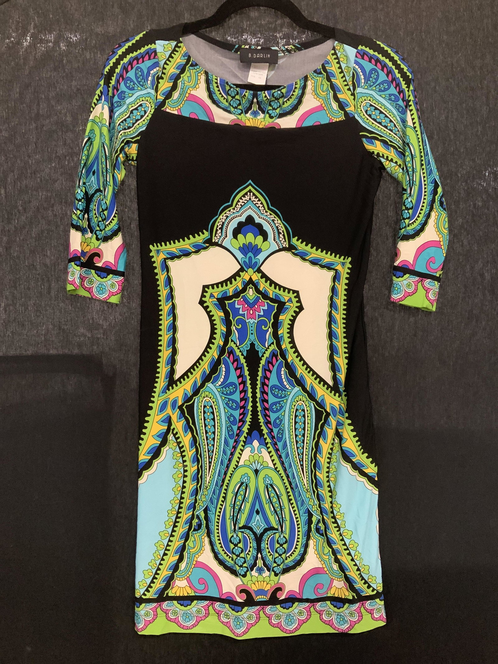 B. Darlin Paisley Indonesian Style Cocktail Dress: Slinky form fitting cocktail dress , size 5/6, Made in USA 95% polyester, 5% Lycra. Vibrant colors on black with long paisleys and Indonesian patterns. 3/4 sleeves, 33 in. Long. B. Darin dress, Luxury