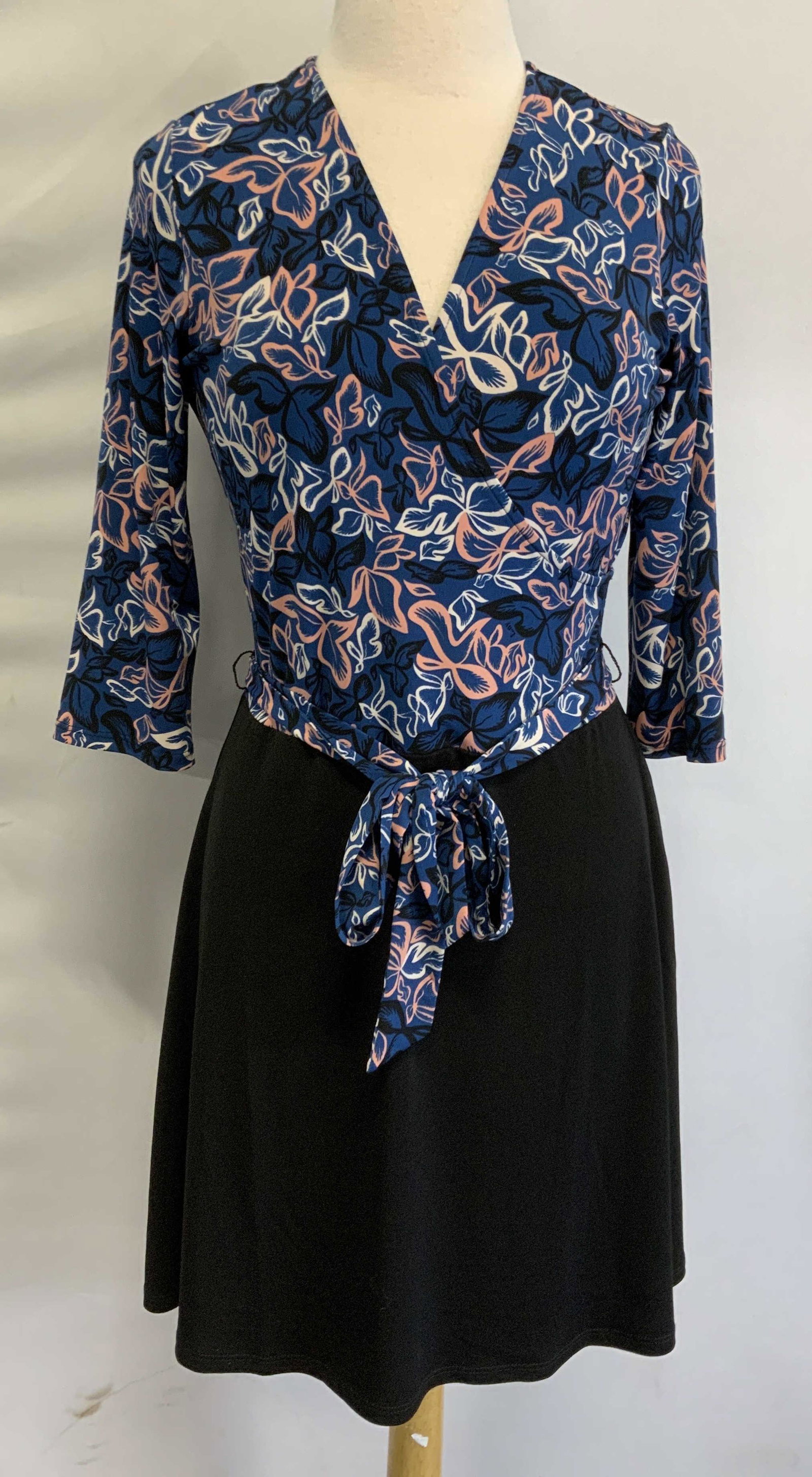 LEOTA Faux Wrap Belted Dress USA: Leota faux wrap belted dress in black and blue multi color floral print. Size L. Polyester and spandex blend. Hand made in New York City. Gently worn. Leota, Leota dress, ladies designer dress, ladies