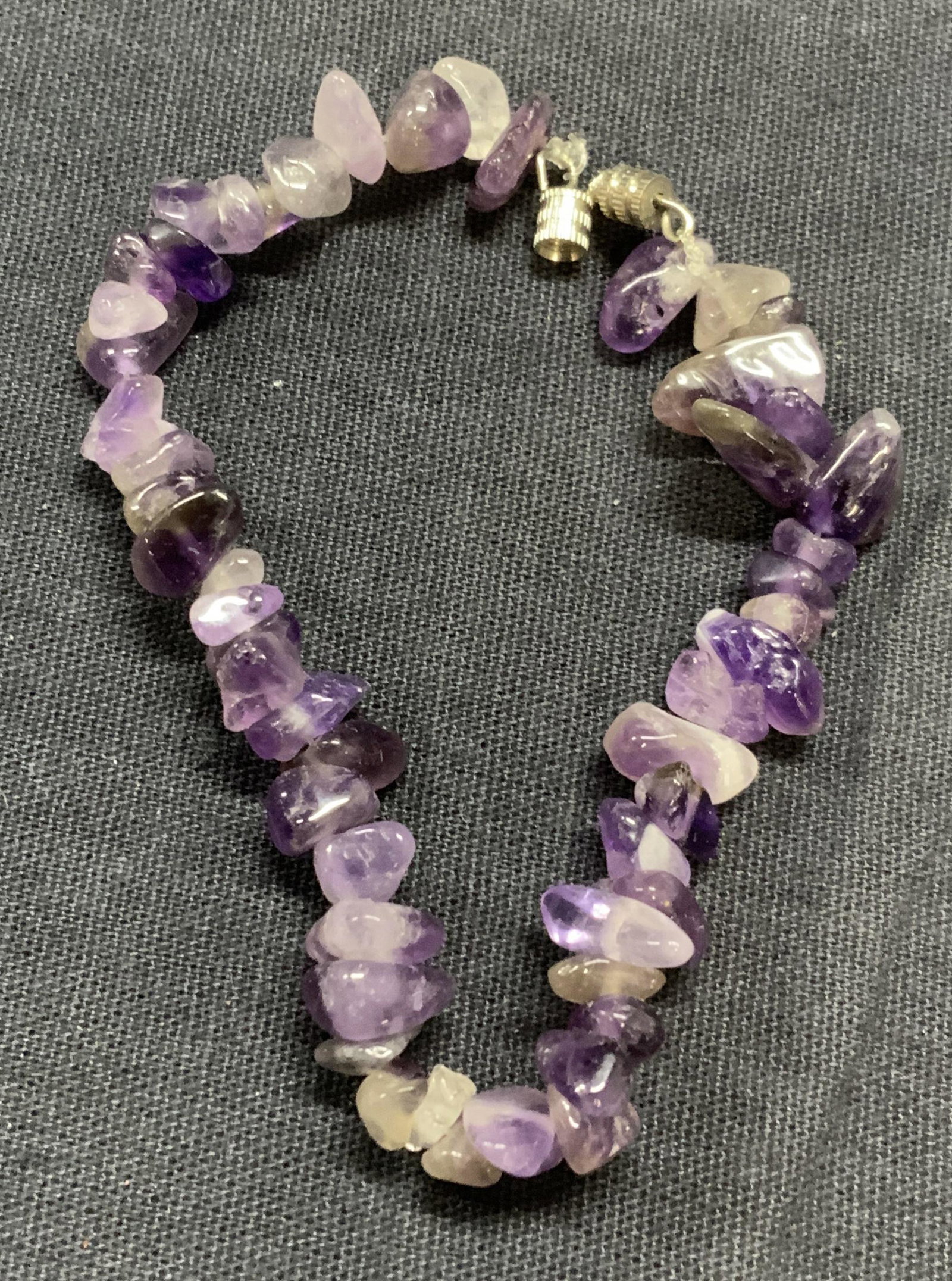 Amethyst Chip Beaded Bracelet, Jewelry: Amethyst chip beaded bracelet. Measures approx. 6.5 inches long. Some surface wear consistent with exposure. Estate jewelry, cocktail jewelry, fashion jewelry, amethyst, amethyst bracelet, gemstone, c