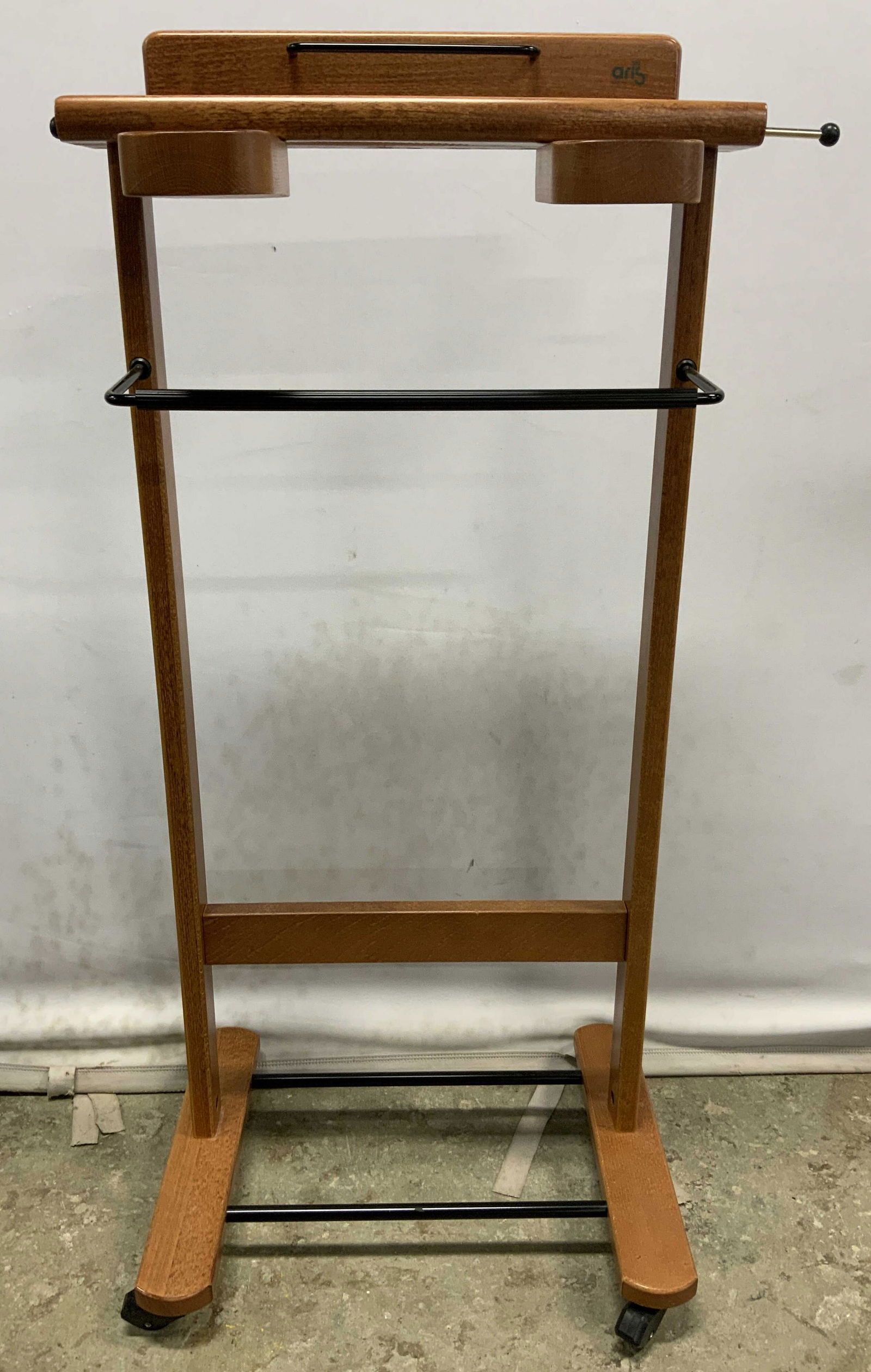 ARIS Wooden Valet Stand On Casters ITALY: Valet stand is trademarked ARIS MADE IN ITALY. Piece appears to be wooden possibly veneer. Piece sits on 4 wheels. Measures approx 37.5 inches tall 17 inches wide 13 inches deep. Aris, aris valet stan