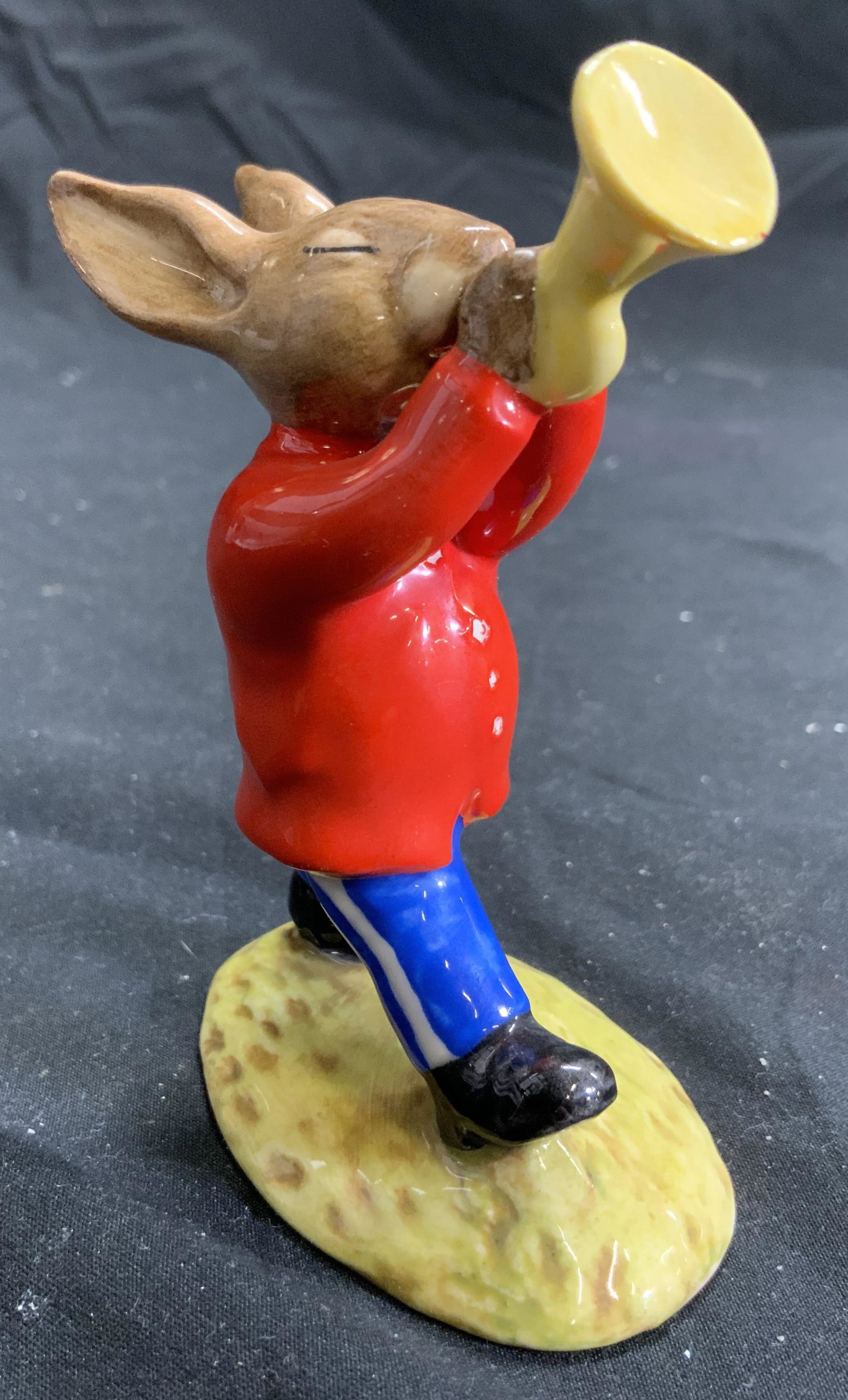 ROYAL DOULTON TRUMPETER BUNNYKINS ENGLAND: Underside reads ROYAL DOULTON TRUMPETER BUNNYKINS FROM THE OOMPAH BAND MADE IN ENGLAND. Piece is porcelain, depict a dressed up rabbit playing the trumpet. Piece measures approx 3.75 inches tall 2.75 