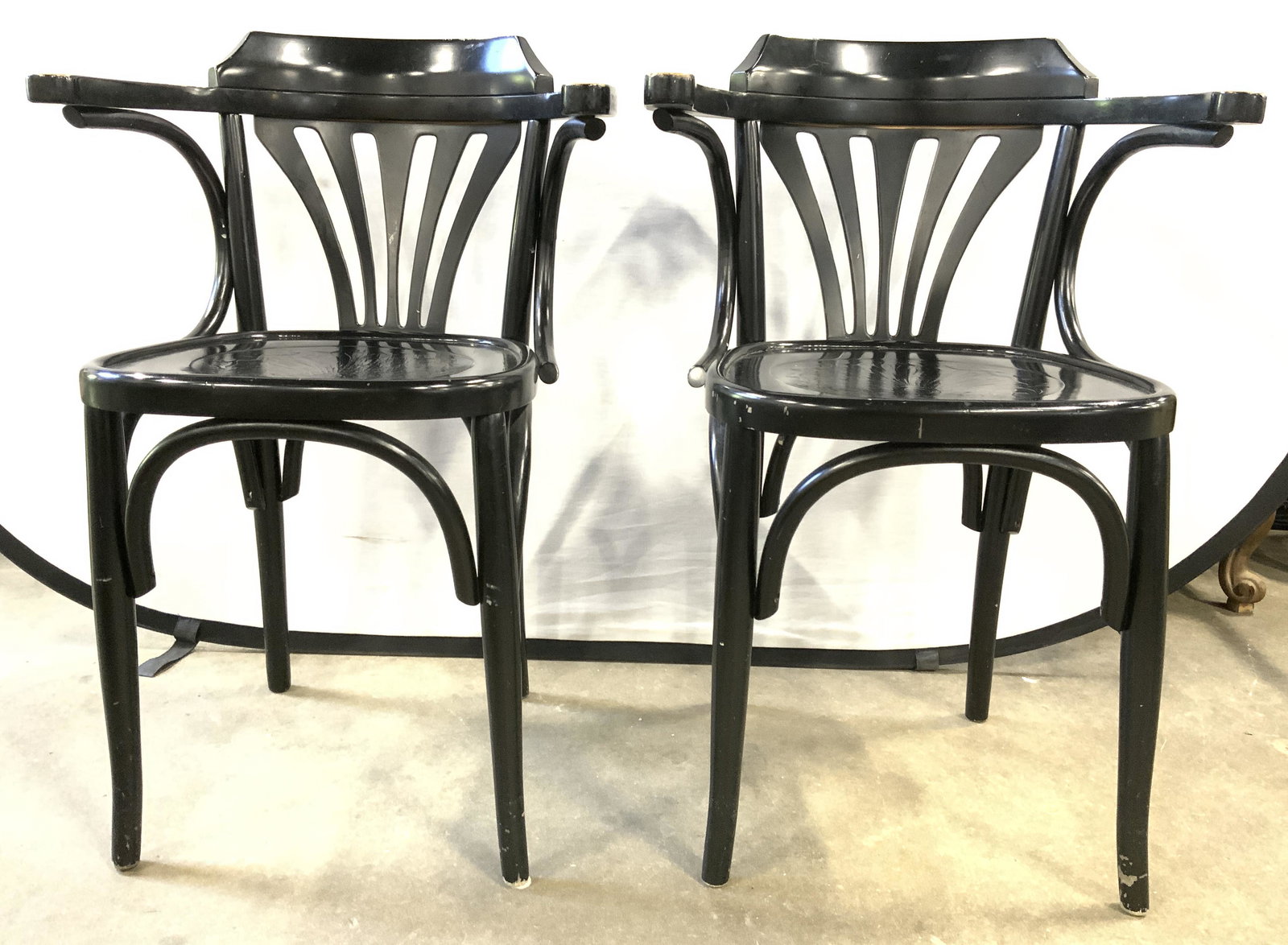Pair Wooden Bistro Chairs Black: Lot includes 2 end chairs. Each are black toned & wooden. Chairs each have bentwood areas. Measures approx 31 inches tall 21 inches wide 19 inches deep. Pair of chairs, black chairs, bistro chairs, re