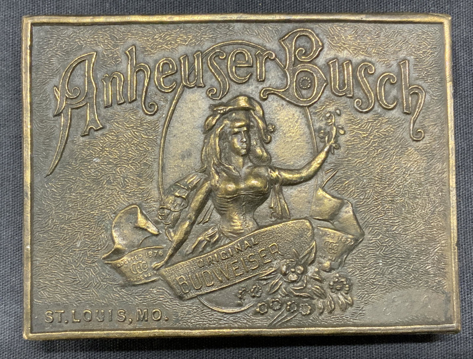 TIFFANY & CO Anheuser Busch Brass Belt Buckle: Vintage Tiffany and Co brass Anheuser Busch belt buckle. Buckle face features Anheuser Busch trademark. Trademarked Tiffany Studio, New York and Tiffany and Co, London, England to underside. Vintage c