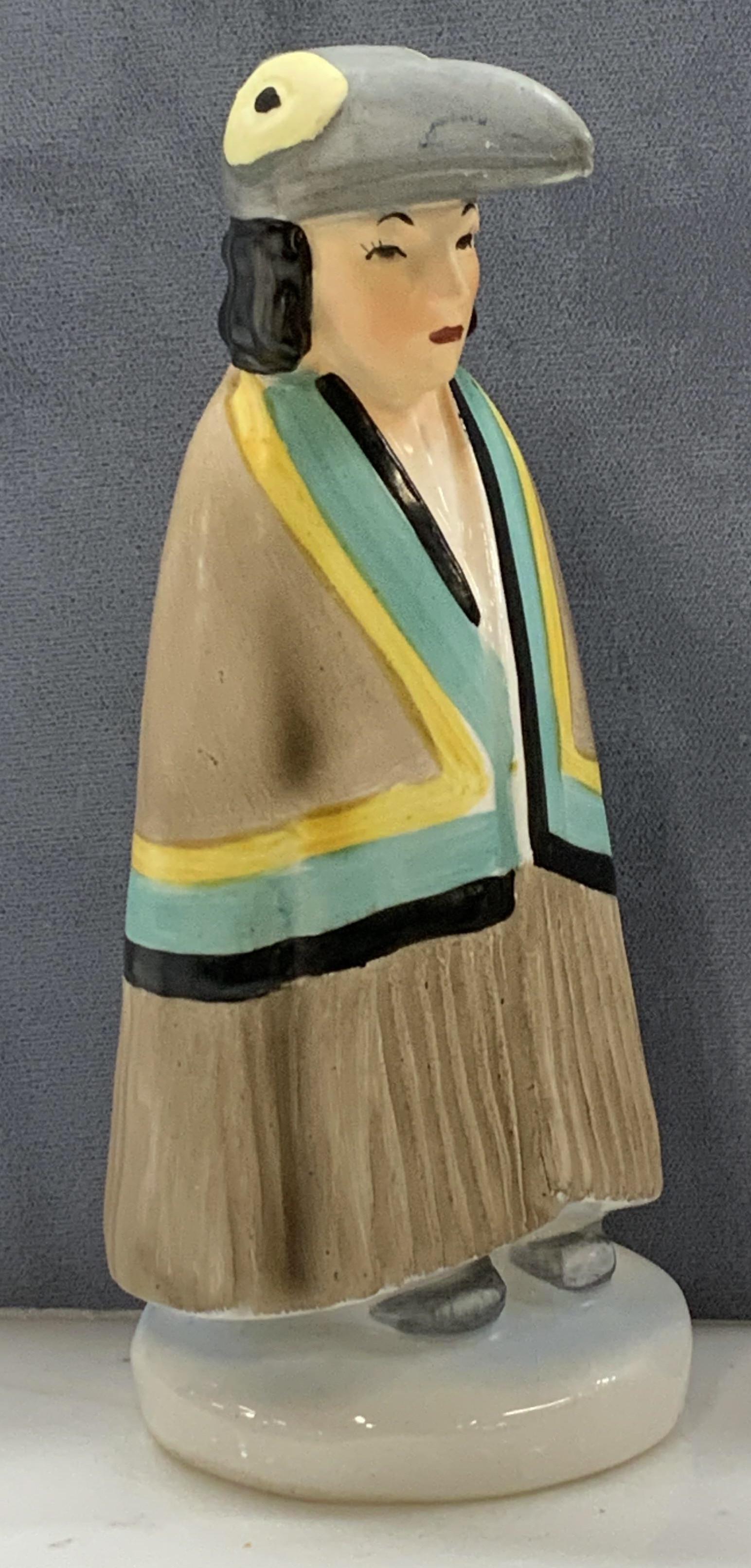 KELVIN Porcelain Native American Figural: Hand Painted Porcelain Figural, Native American Women wearing a ceremonial bird headdress and cloak. Signed Kelvin c-312. 6 x 3 in. Native American home decor and accessories, Kelvin porcelain Native 