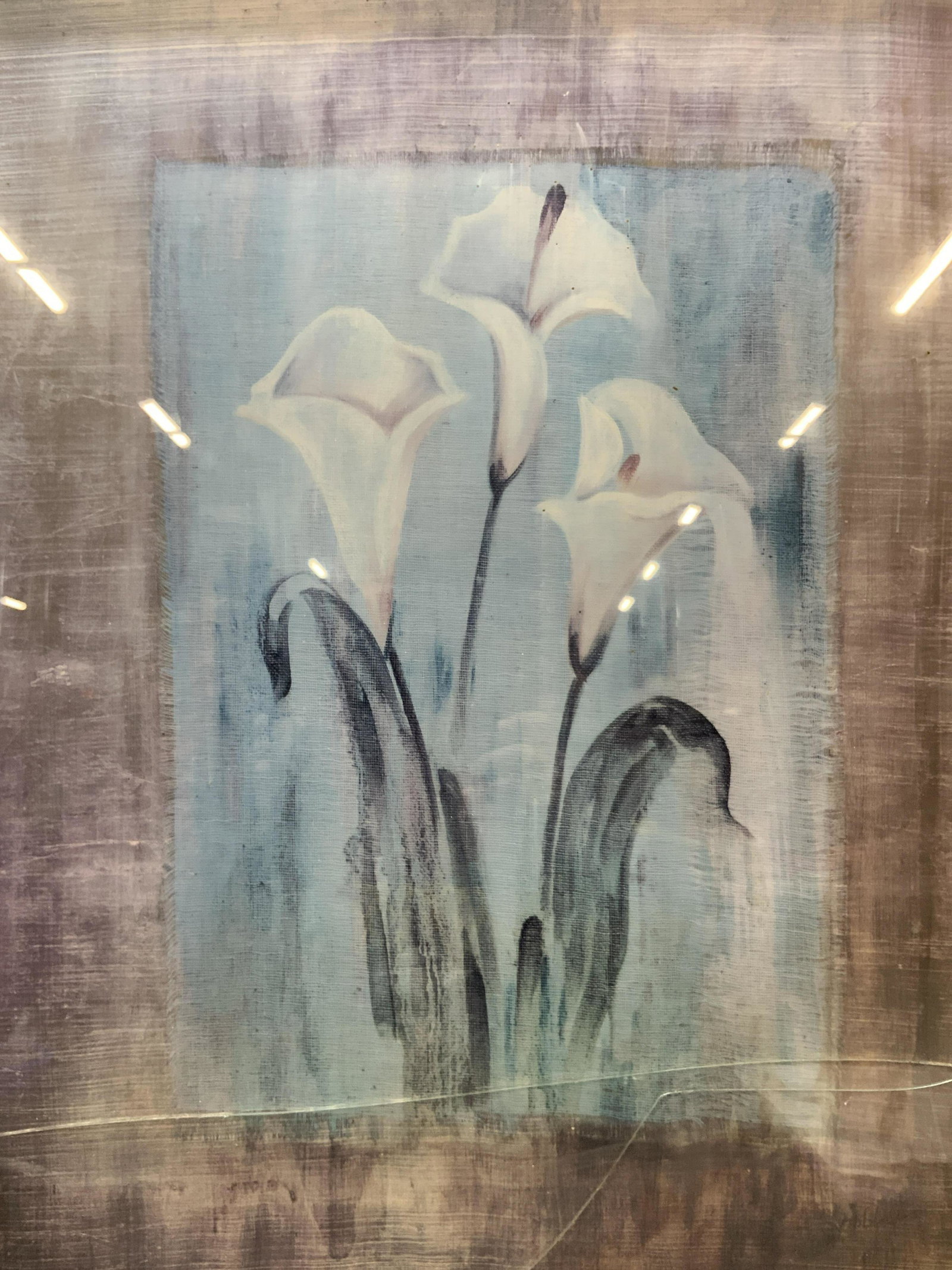 Elizabeth Robbins Gilded Lily Framed Litho: Marked on lower left corner, Elizabeth Robbins, Gilded Lily, Subject depicts a group of three white lilies with a blue background. Framed in gold metal leafed wooden frame, under glass.Approximately 2