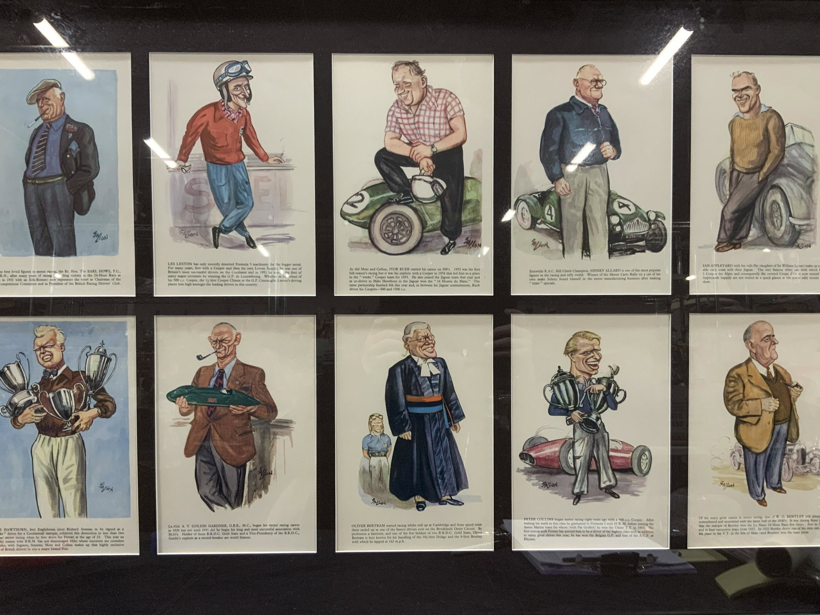 Ralph Sallon Motor Racer Caricatures Grid Lithos: A grid of 10 Caricatures lithos of various racers and driver club members, ranging from Mike Hawthorn to Peter Collins All marked on lithos Sallon. Framed in a dark wooden frame with dark brown grid c