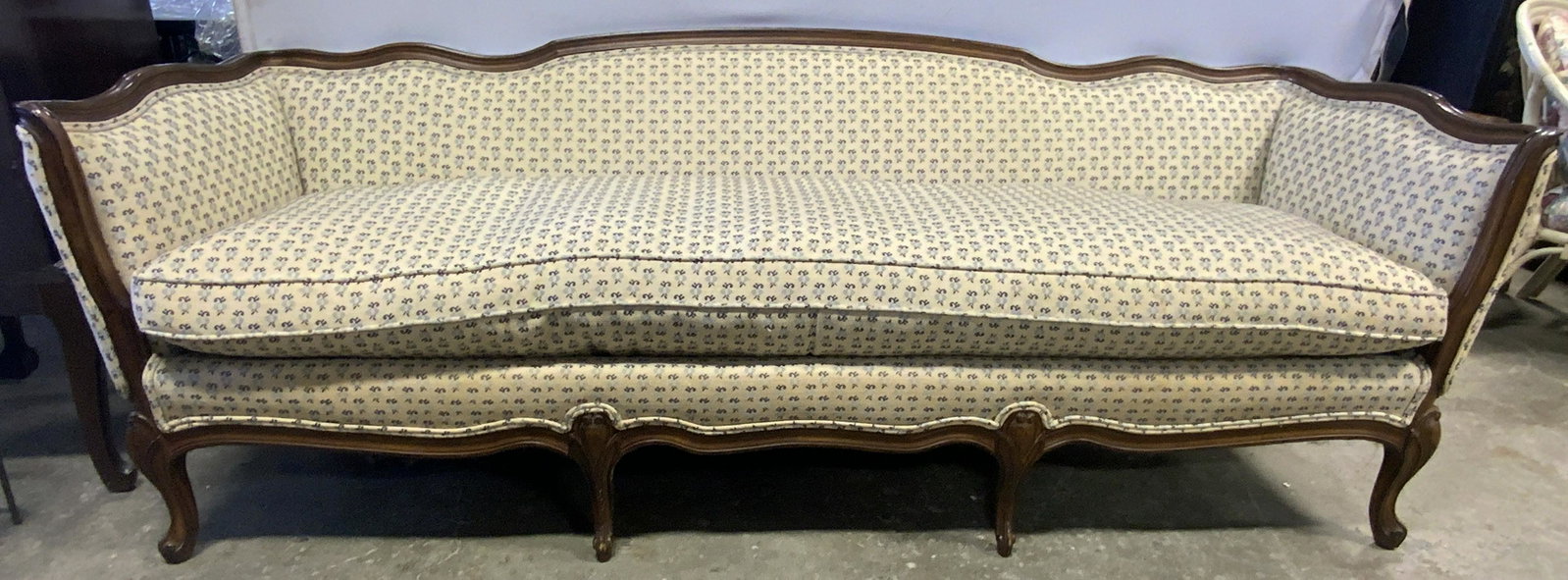 Vntg French Louis XV Prov Style Serpentine Sofa: Sofa is vintage possibly antique. Piece is French Louis XV provincial style. Piece has carved wooden frame with 6 feet. Some edges of upholstery have double welting. Sofa measures approx. 84 inches lo