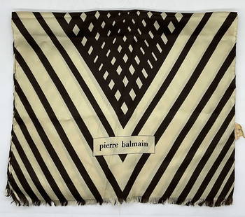 Pierre Balmain Saks Fifth Ave Silk Scarf, France: Significant wear to piece, some stains and thread pulling present. Label reads Made in France, Saks Fifth Ave, 100% Silk. Signature to front. Measures approx 50 x 15 inches. Hand rolled edges. Silk sc