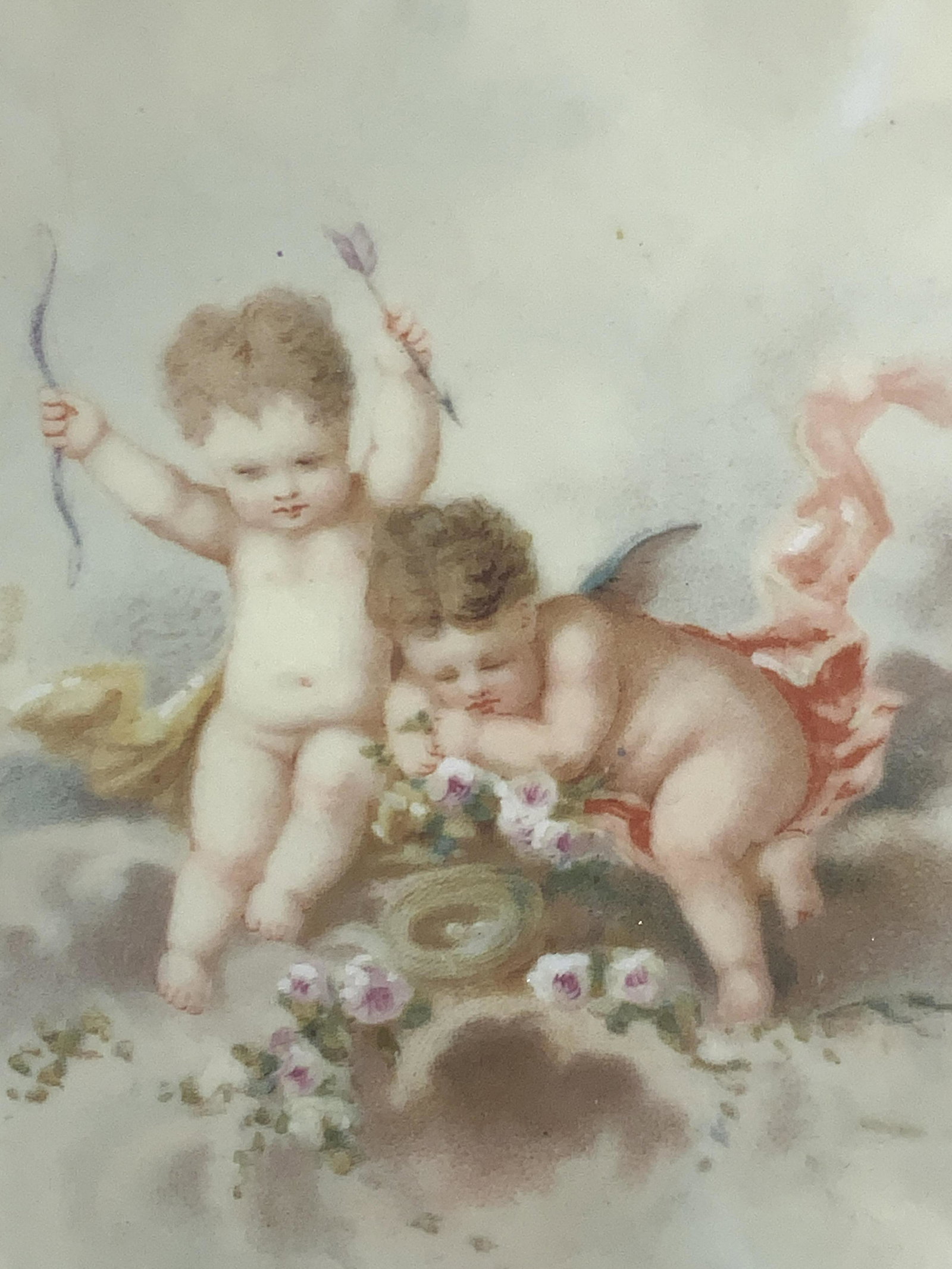 LIMOGES Porcelain Cherub Plate: Marked Limoges on underside, Floral inspired plate with gilt edges and image of cherubs on center. Approximately 9.25 inch diameter. Evident wearing to gilt to edges. Limoges porcelain dish, porcelain