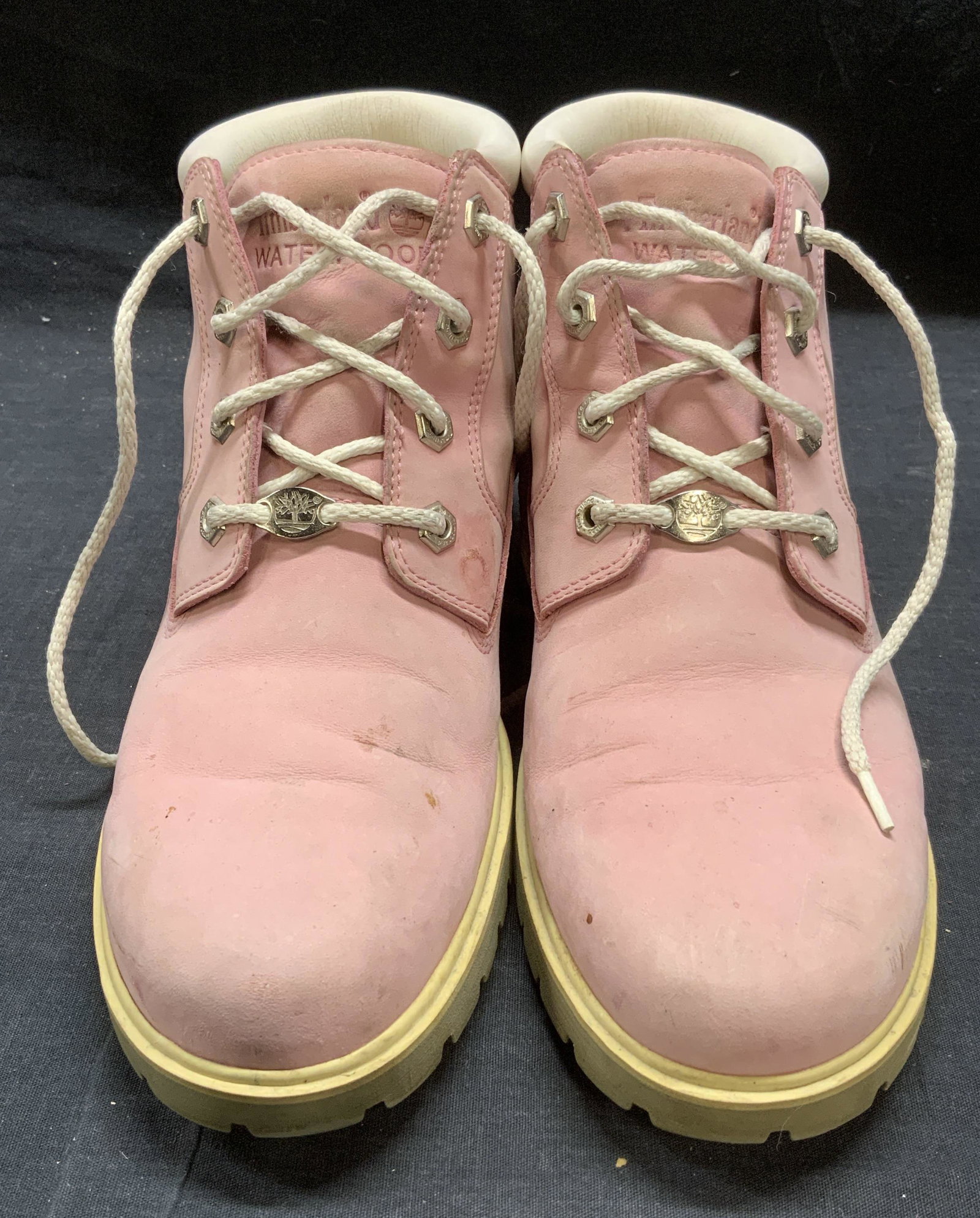 TIMBERLAND Pink Leather Boots: Timberland pink leather boots. Size 10. Genuine leather and man made materials. Wear to materials consistent with exposure. Designer label to soles and tongue. Timberland. Timberland boots, ladies tim