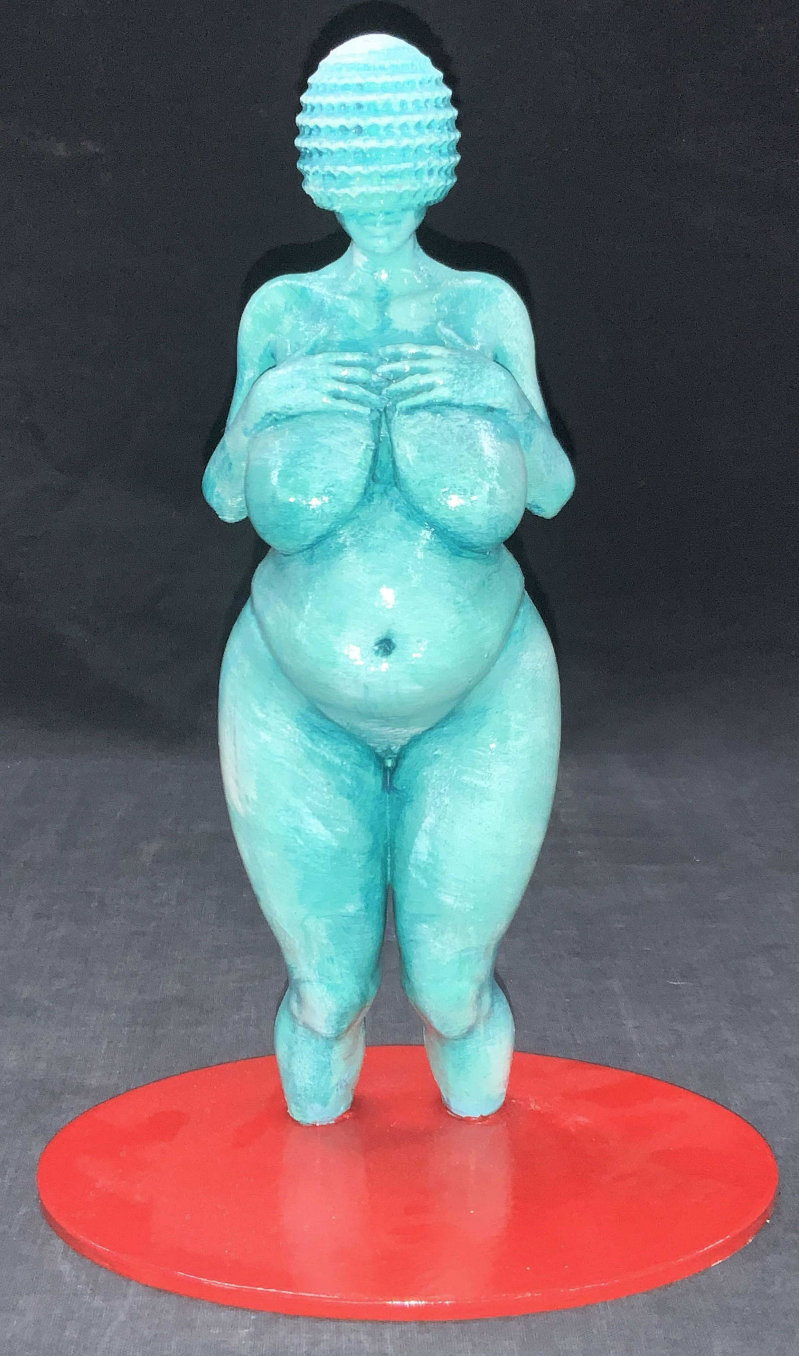 Eric PETA Signed Plaster Venus Of Willendorf: Singed on underside Eric PETA Figure depicting a teal toned nude woman Figural replicating the woman of Willdendorf fertility sculpture. Rounded head with no eyes or nose and rounded body with wide hi