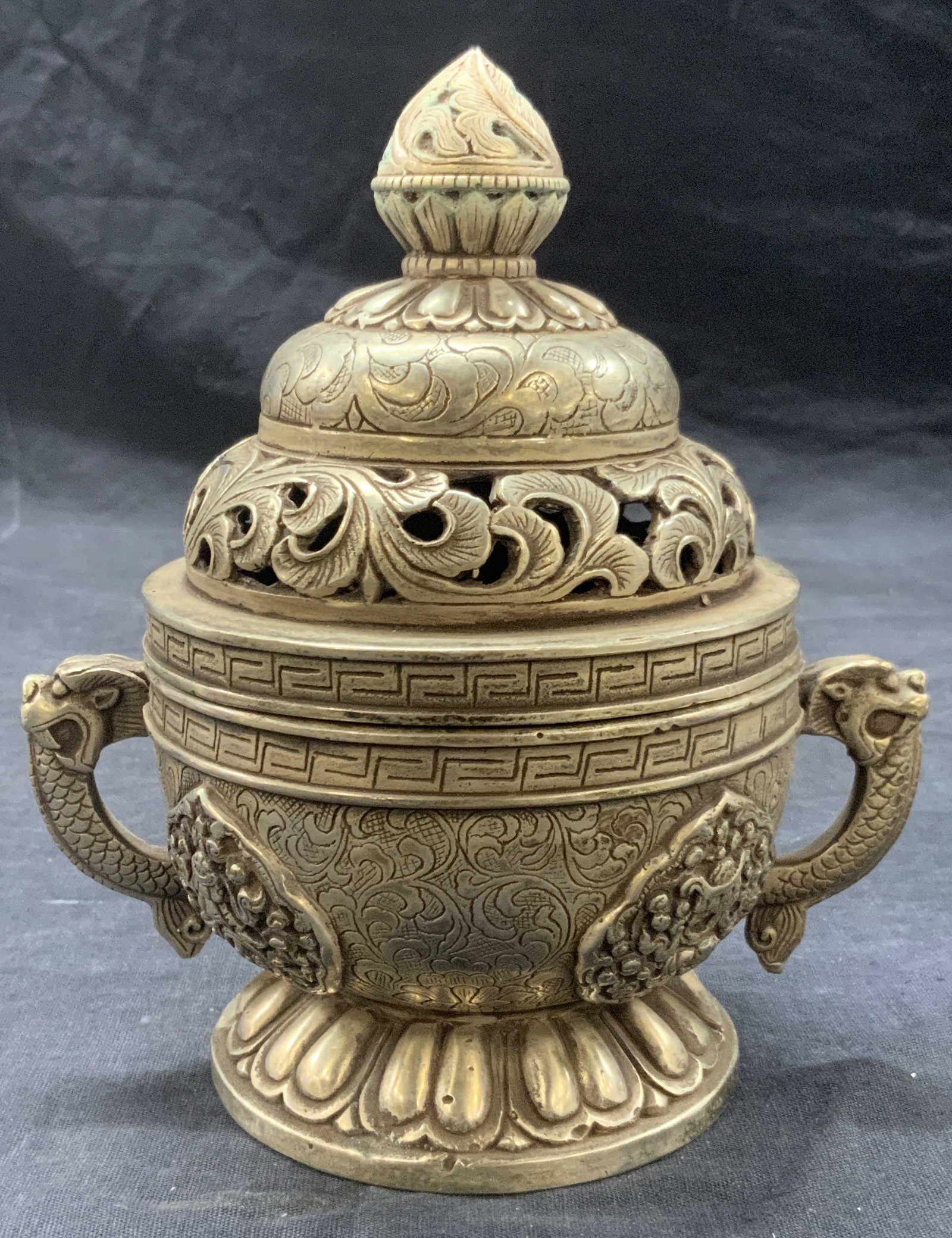 Asian Dragon & Floral Metal Censer: Asian metal made incenser with dragon side handles and floral patterns with cut outs on the lid. Approximately 7 inches tall and 4 inch diameter, Moderate wearing to overall metal. Asian incenser, Asi