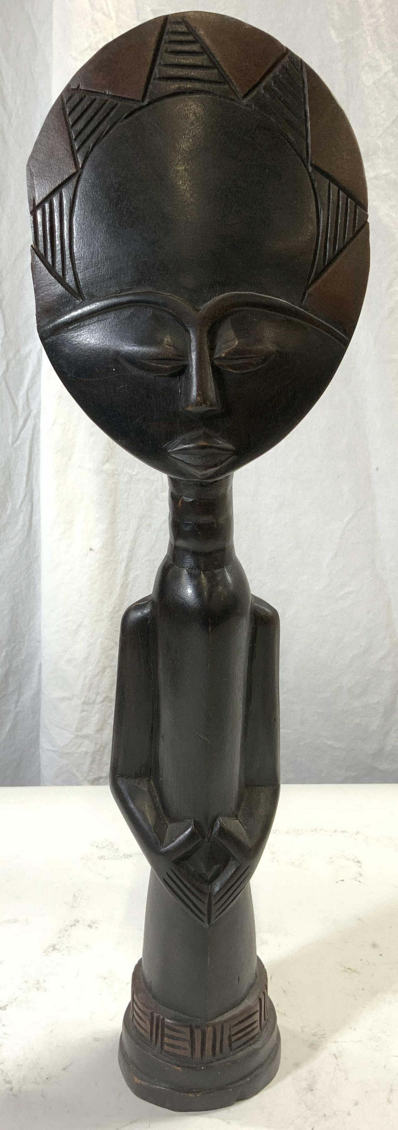 Hand Crafted Carved Wood African Tribal Figural: Hand crafted carved wood tribal African figural. Piece is brown toned & wooden. Geometric relief detail. Measures approx. 5.5 in W, 3 in D, 19 in H. African figural, tribal African figural, African fi