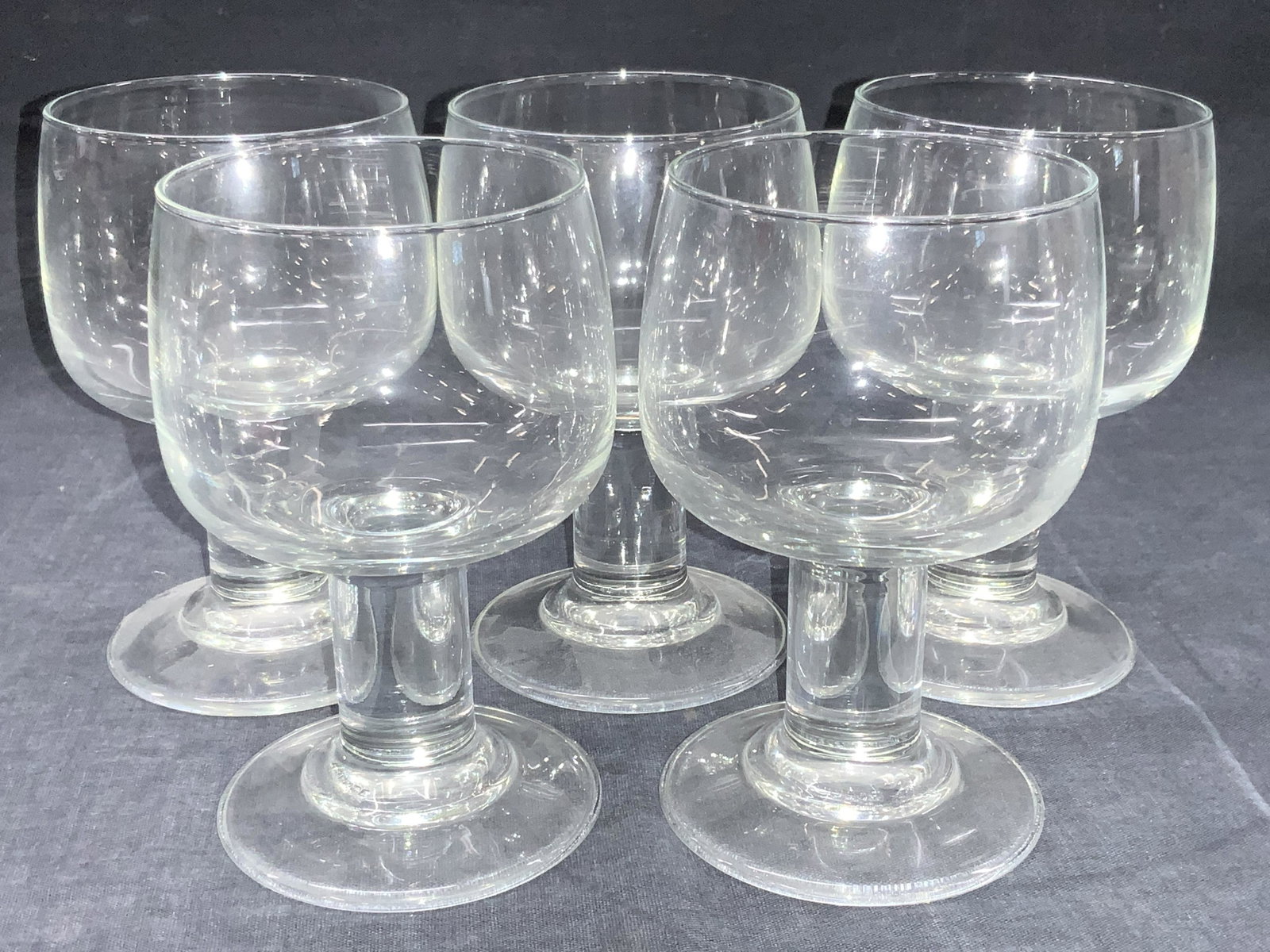 Set 5 Crystal Thick Stemware Glasses, France: Set 5 Crystal stemware glasses with thick stems. Marked France on undersides. Approximately 5 inches tall and 2.75 inch diameter. Minor wearing to undersides due to age and use. Crystal stemwares, ste