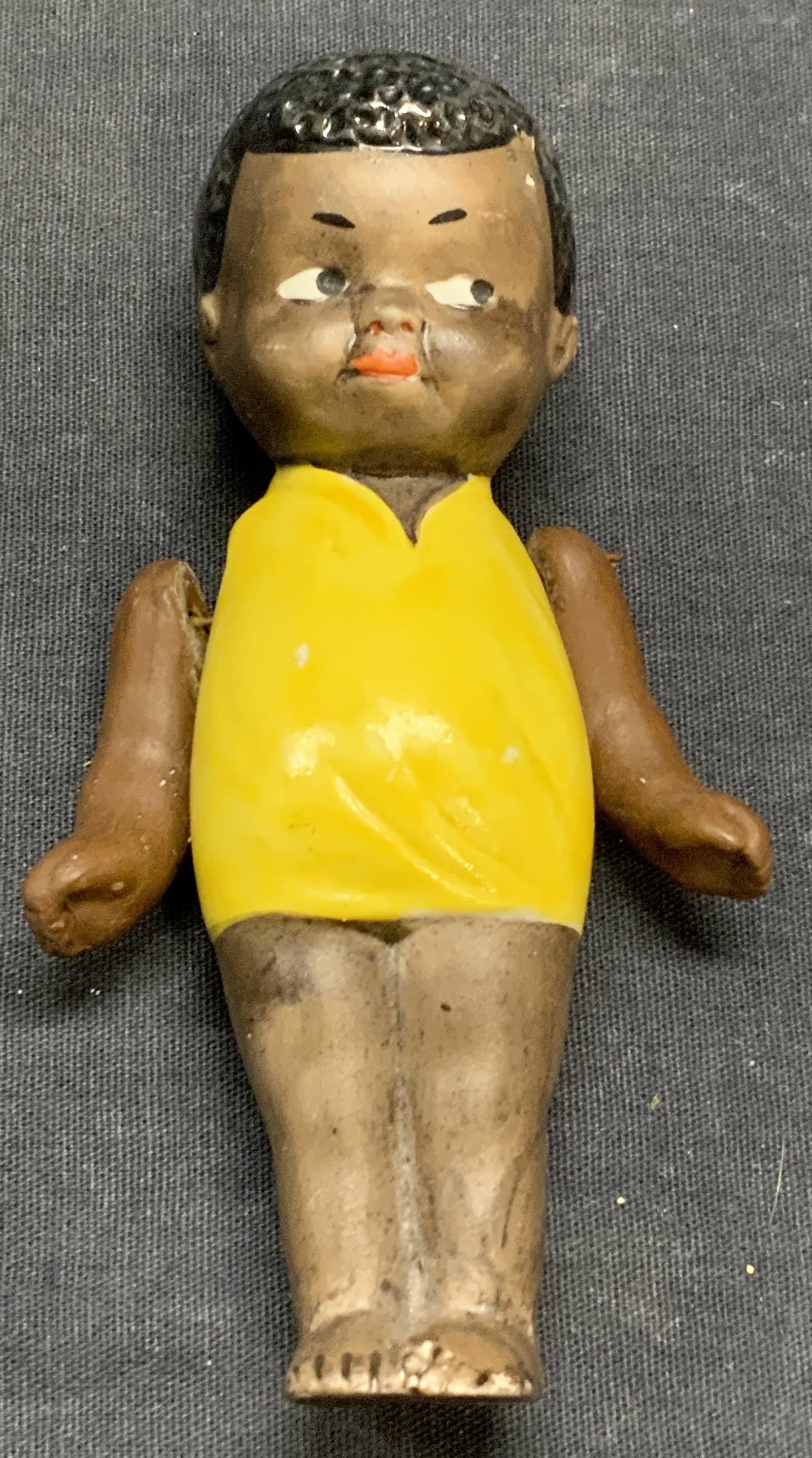 Antique Porcelain Baby Doll, Nippon: Antique porcelain baby doll. Marked Nippon to back. Some surface wear consistent with exposure. Measures approx. 4.75 inches long. Nippon porcelain, antique porcelain doll, porcelain baby doll, antiqu