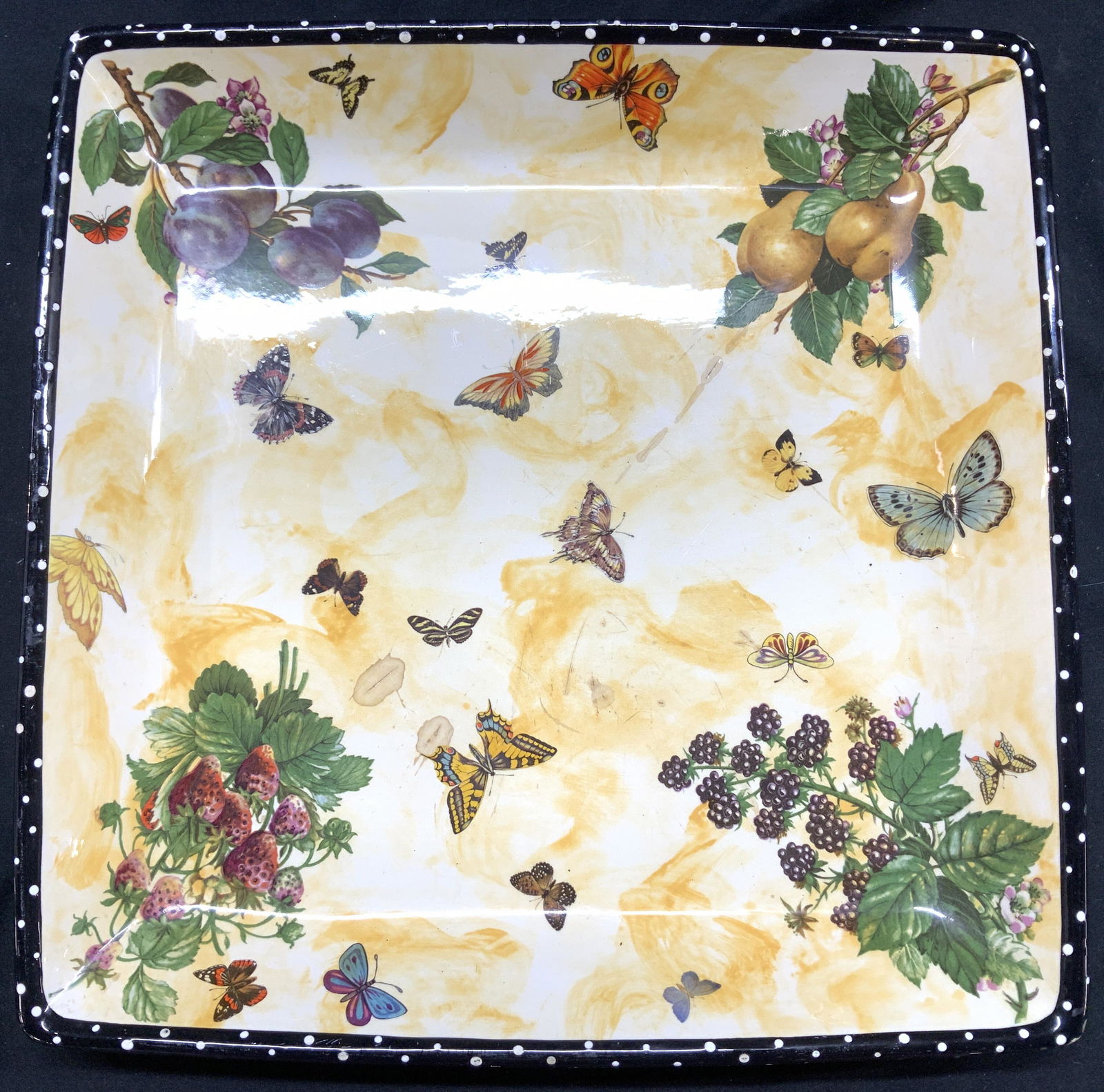 Kiwi Studios Porcelain Butterfly Platter, USA: Hand Painted porcelain Platter with butterflies and fruit, stamped Kiwi Studios Inc. by Bill Smith based in Salem, Mass. Chips to outer rim noted. Some surface wear, all consistent with use, age and e
