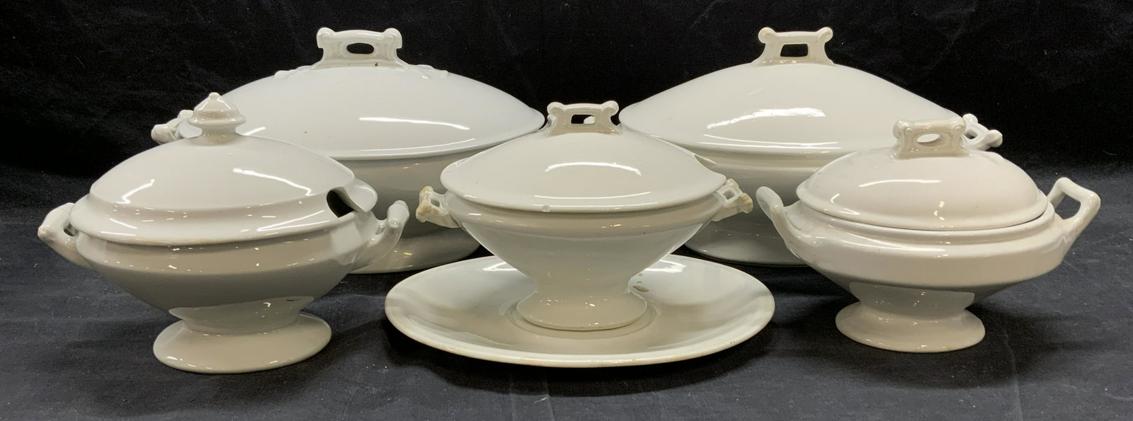 Lot 5 White Porcelain & Ironstone China Tureens: Lot of 5 white porcelain and ironstone china tureens. 1 marked J & G Meakin, measures approx. 8.25 x 5.25 x 6.5 inches. 1 marked MADDOCK & Co, measures approx. 12 x 7.25 x 7 inches. 1 marked J Wedgwoo
