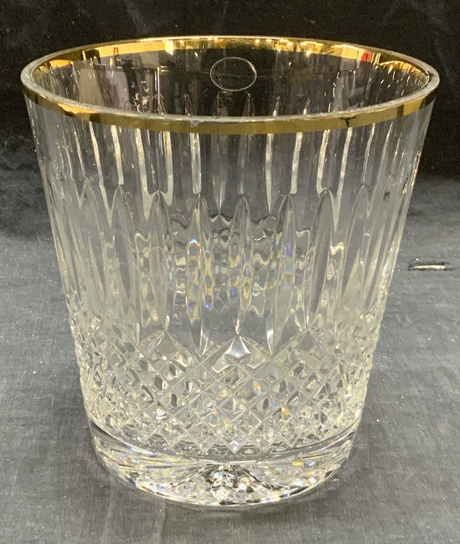 Vintage WEDGWOOD Cut Crystal Gilt Ice Bucket: Vintage Wedgwood cut lead crystal ice bucket with gilt rim. Some surface wear consistent with exposure, loss to gilt observed. Measures approx. 6 1/8 inches diameter and 6.25 inches. Trademarked on st