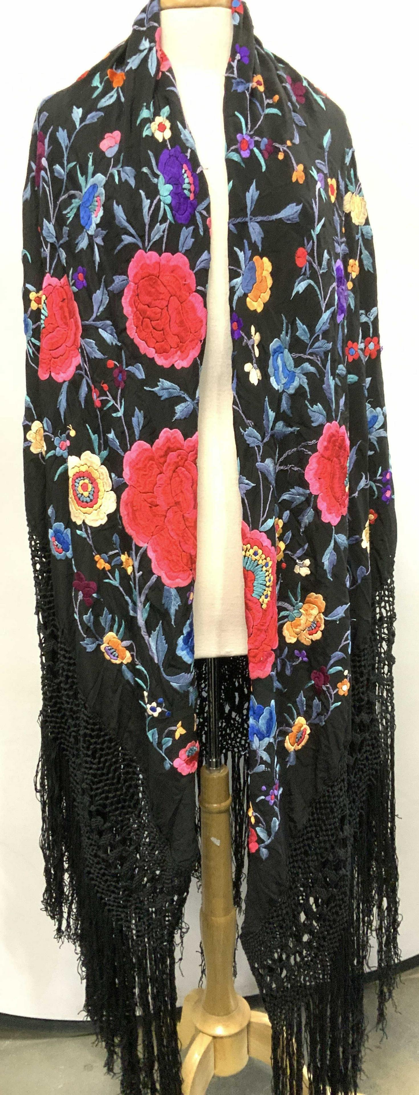 Black Embroidered Silk Flamenco Shawl, Spain: Beautiful Vintage floral silk flamenco shawl with long tassels, black silk with bright silk embroidery , full of pinks, blues, lavender, and orange. Shawl measures 60 x 61 in. Add 18 in. all around fo