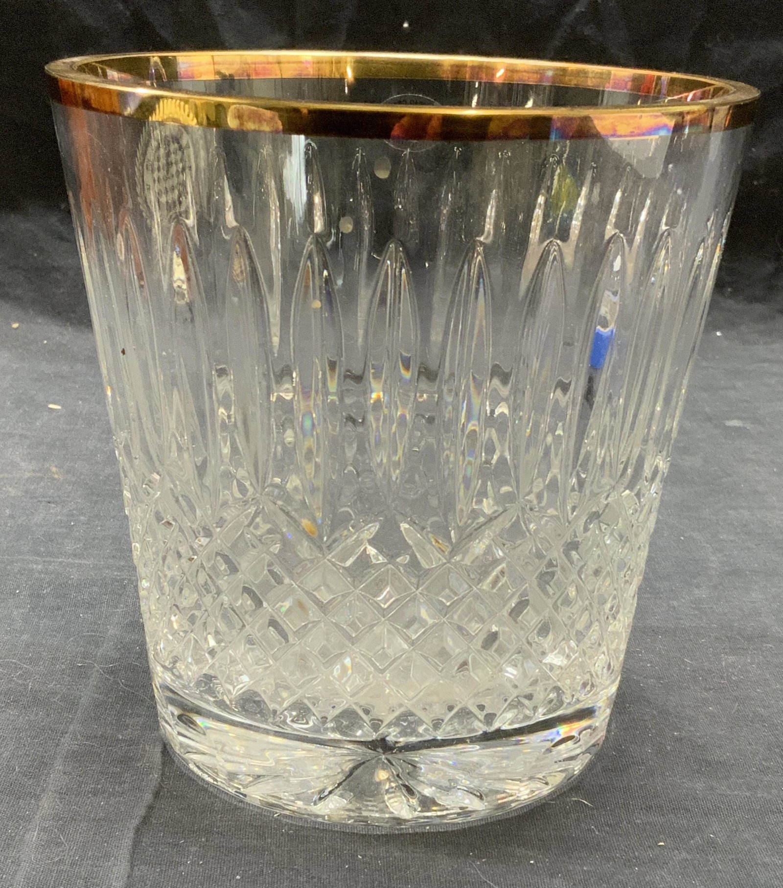 Vintage WEDGWOOD Cut Crystal Ice Bucket: Vintage Wedgwood cut lead crystal ice bucket with gilt rim. Some surface wear consistent with exposure, loss to gilt observed. Measures approx. 6 1/8 inches diameter and 6.25 inches. Trademarked on st