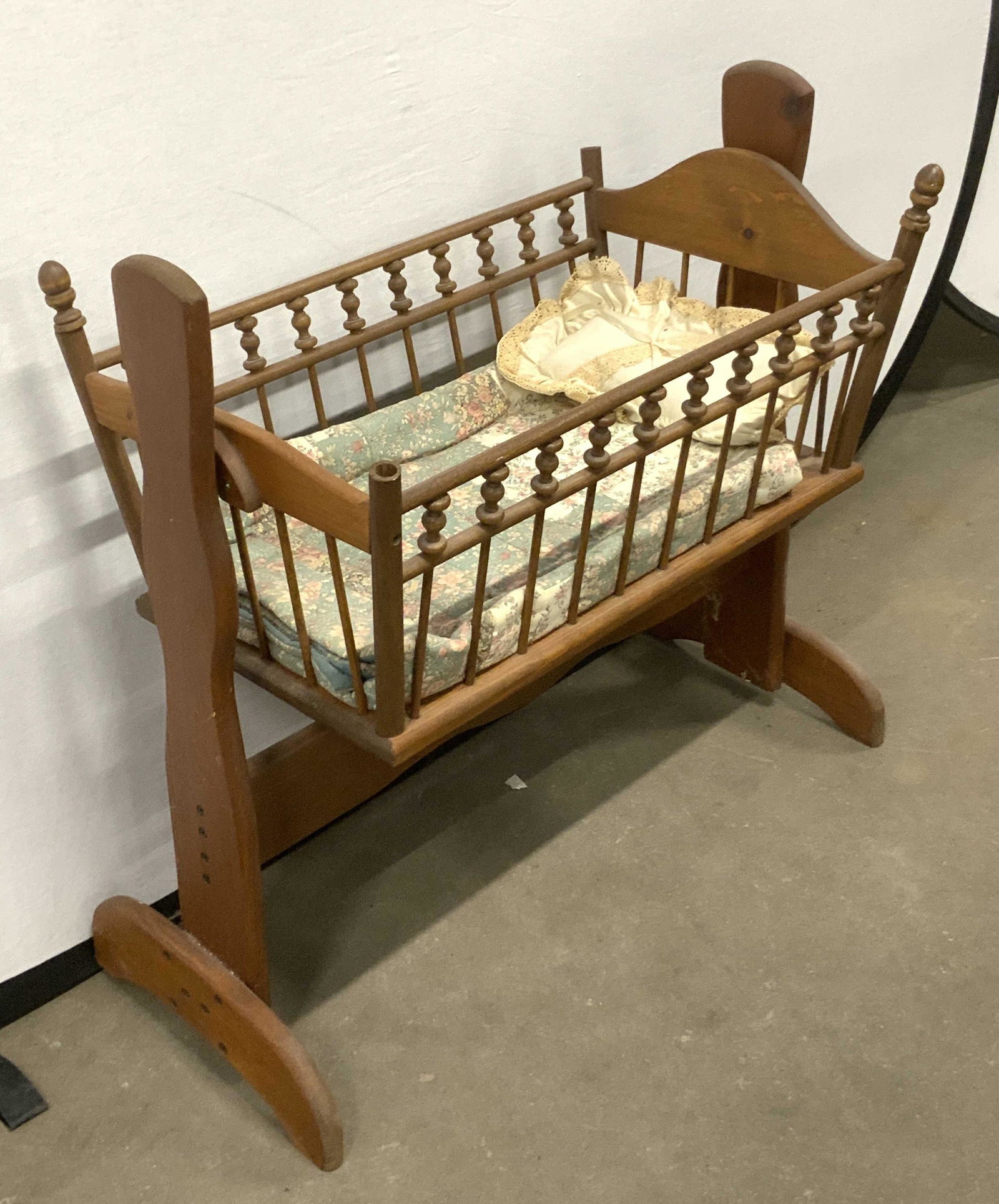 Vintage Wooden Rocking Cradle: Vintage Possibly Antique Wooden Rocking Cradle, with linen quilt and pillow, measures approx 24 1/2H x 24L x 13W in., 2 knobs missing, 1 loose knob. Vintage wooden rocking cradle, antique rocking crad